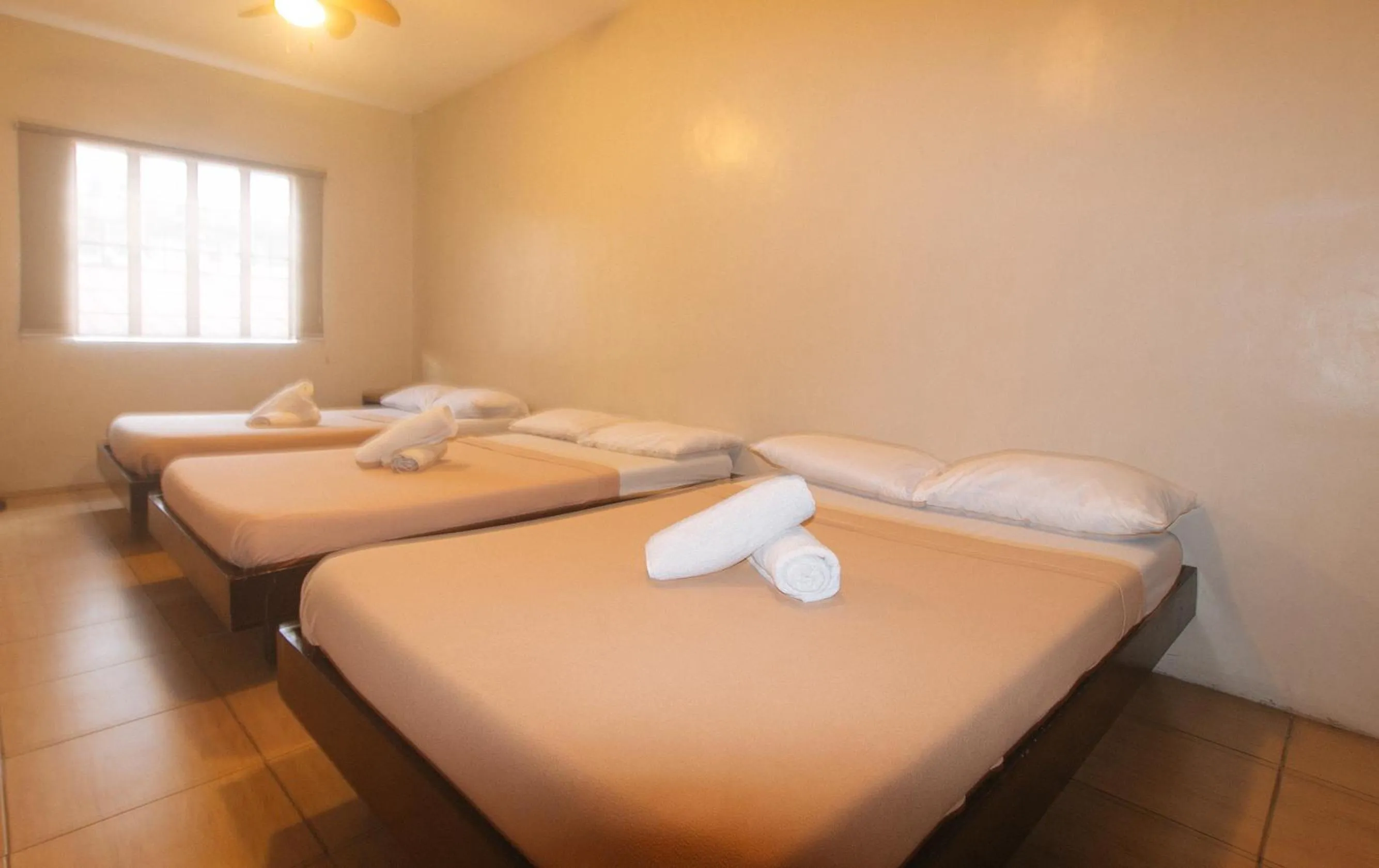 Bed in Metro Deluxe Residences near World Trade Center