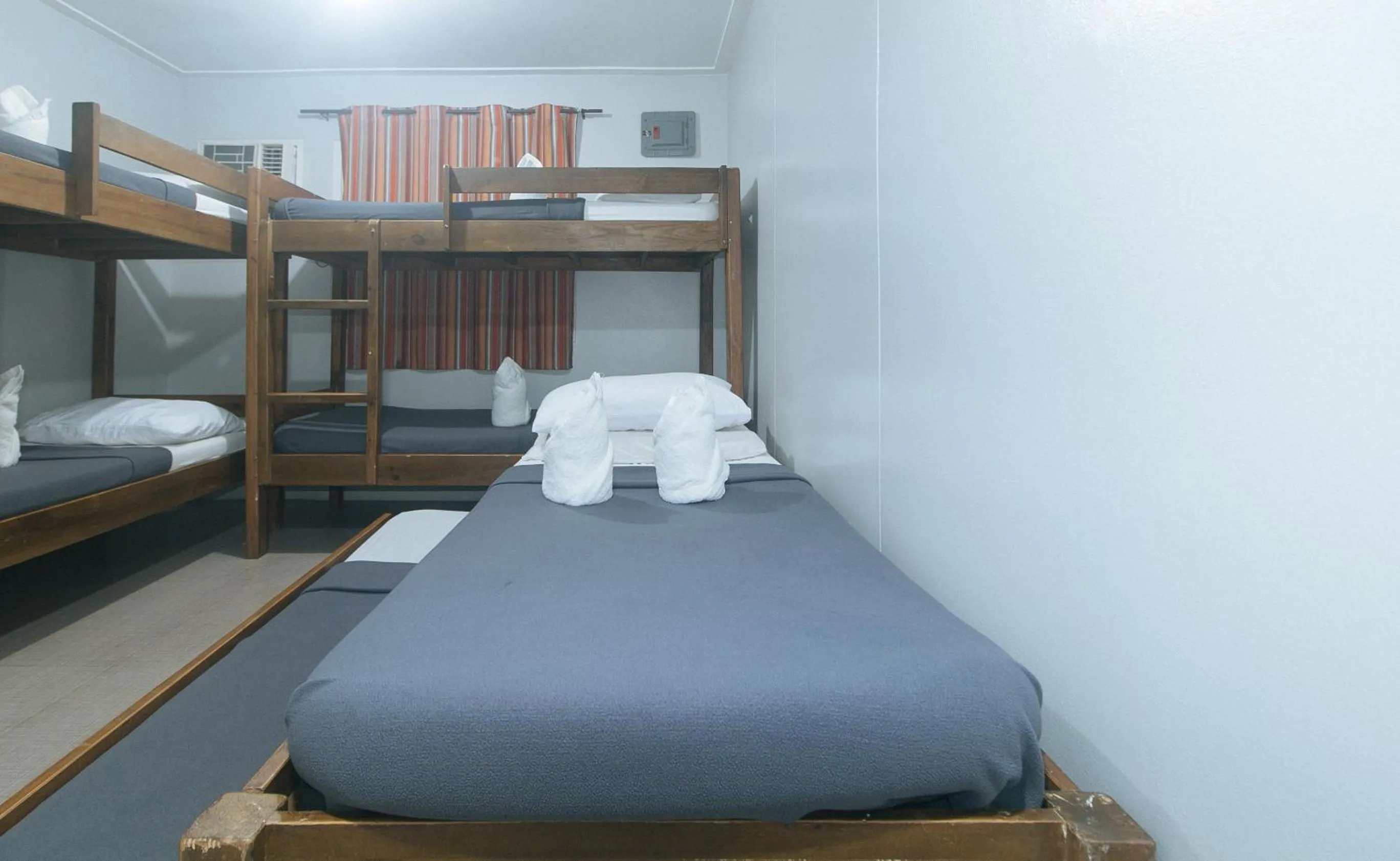 Bed in Metro Deluxe Residences near World Trade Center