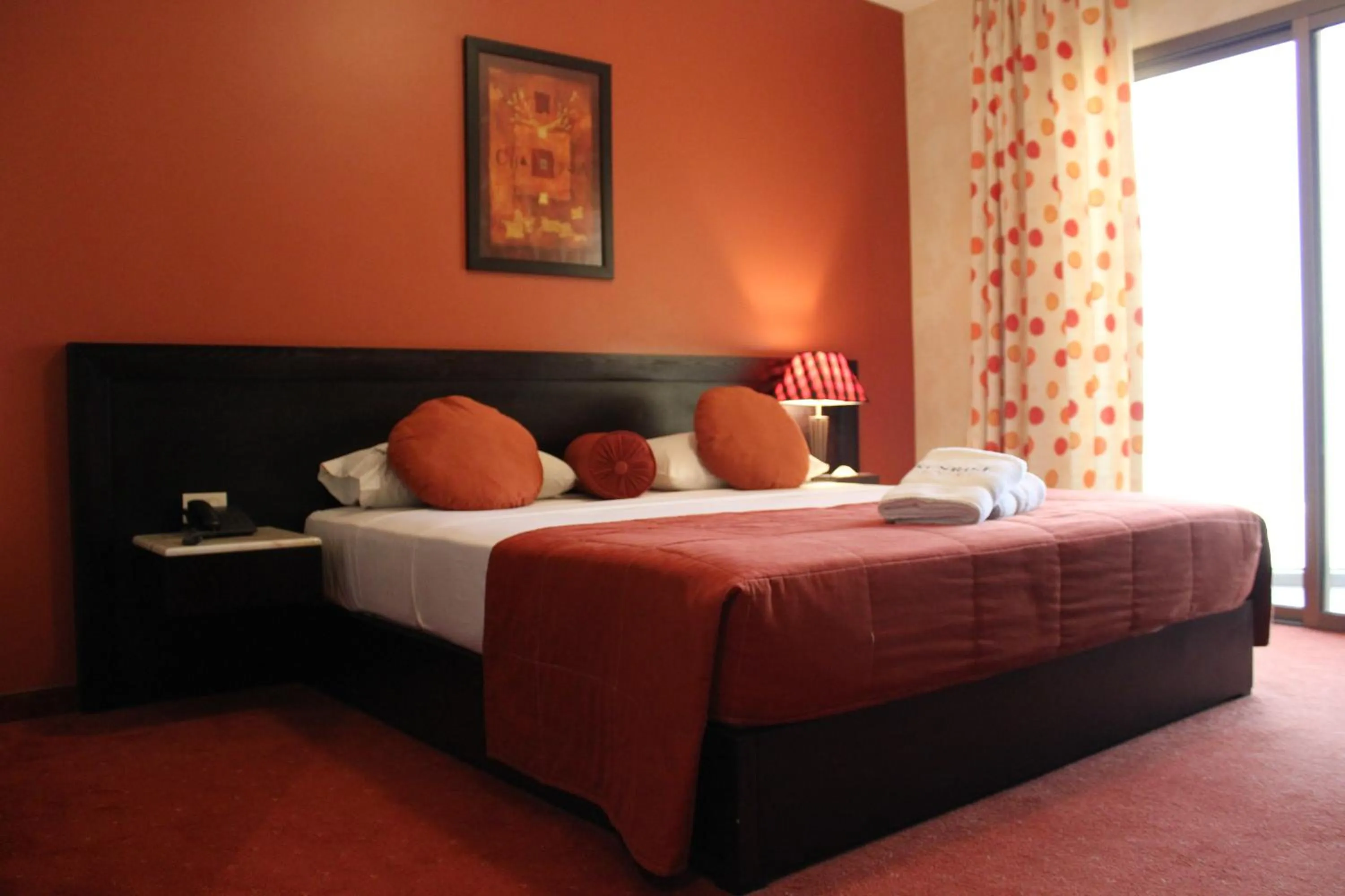 Bed in Sunrise Hotel