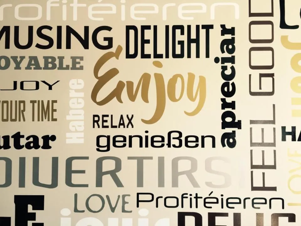 Property logo or sign in Hotel Enjoy