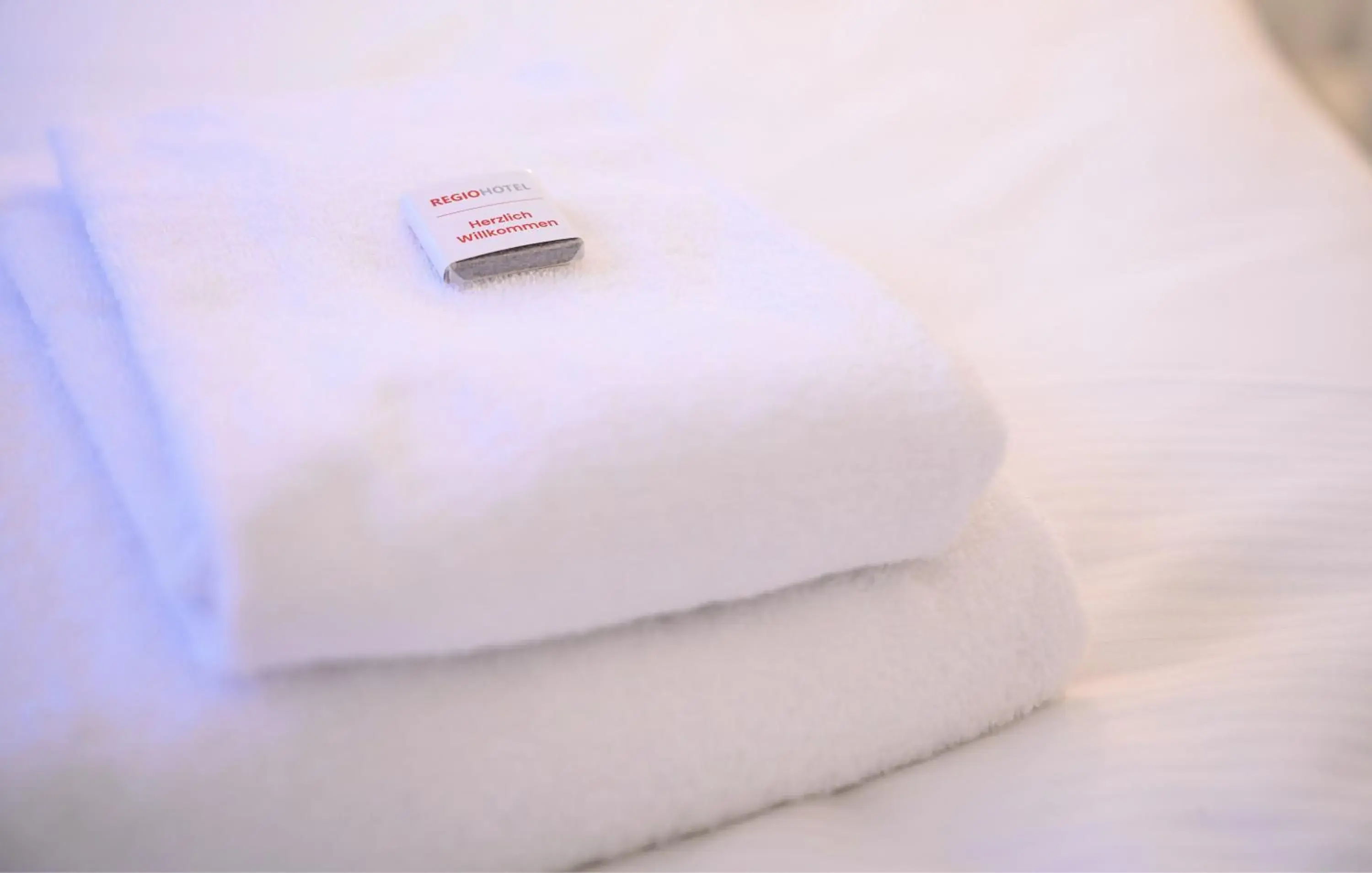 towels, Bed in REGIOHOTEL Halle Leipzig Airport towels, Bed in REGIOHOTEL Halle Leipzig Airport