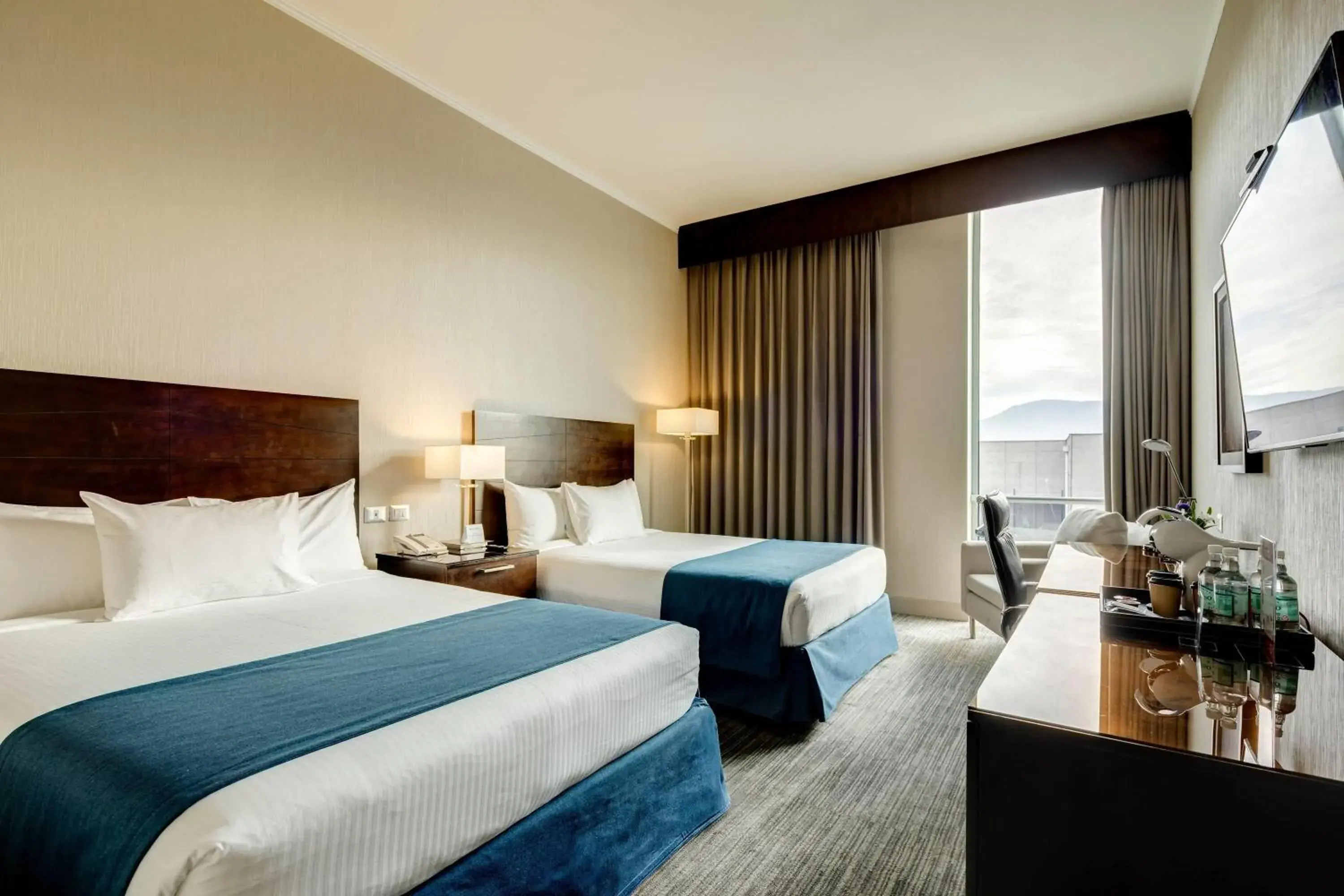 Photo of the whole room, Bed in Wyndham Santiago Aeropuerto Photo of the whole room, Bed in Wyndham Santiago Aeropuerto