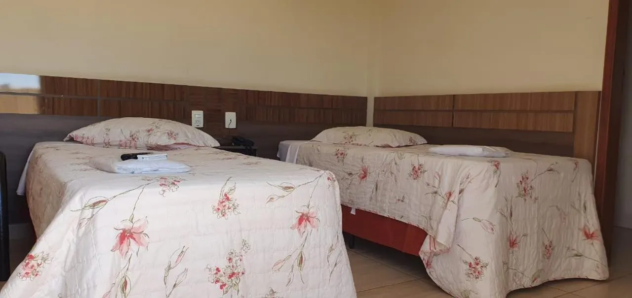 Bed in Colorado Plaza Hotel