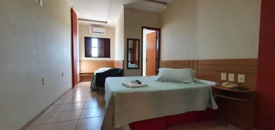 Bed in Colorado Plaza Hotel