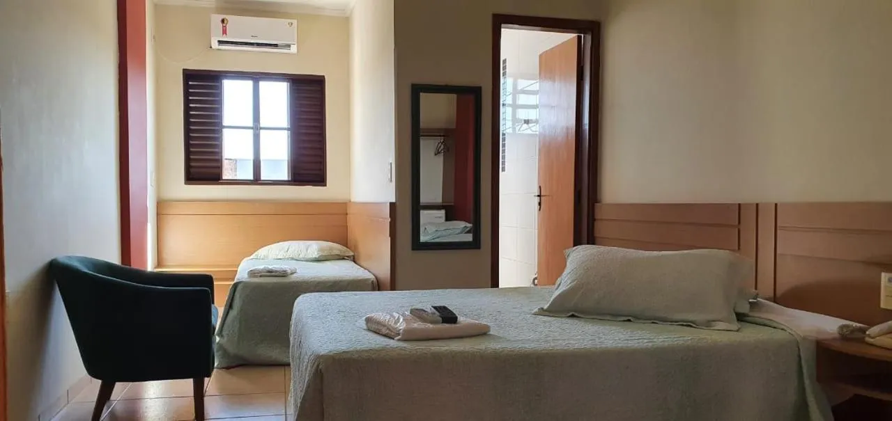 Bed in Colorado Plaza Hotel