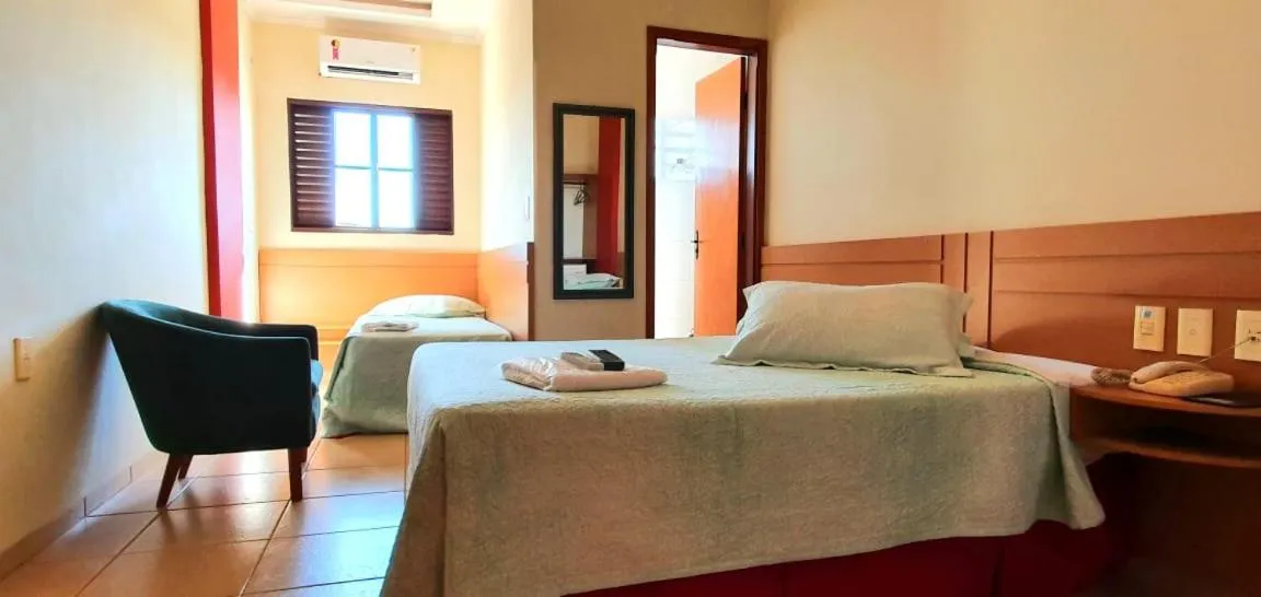 Bed in Colorado Plaza Hotel