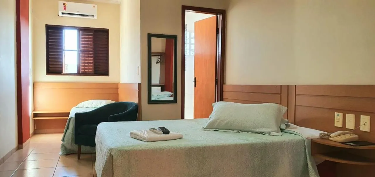 Bed in Colorado Plaza Hotel