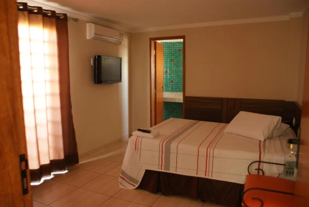 Bed in Colorado Plaza Hotel