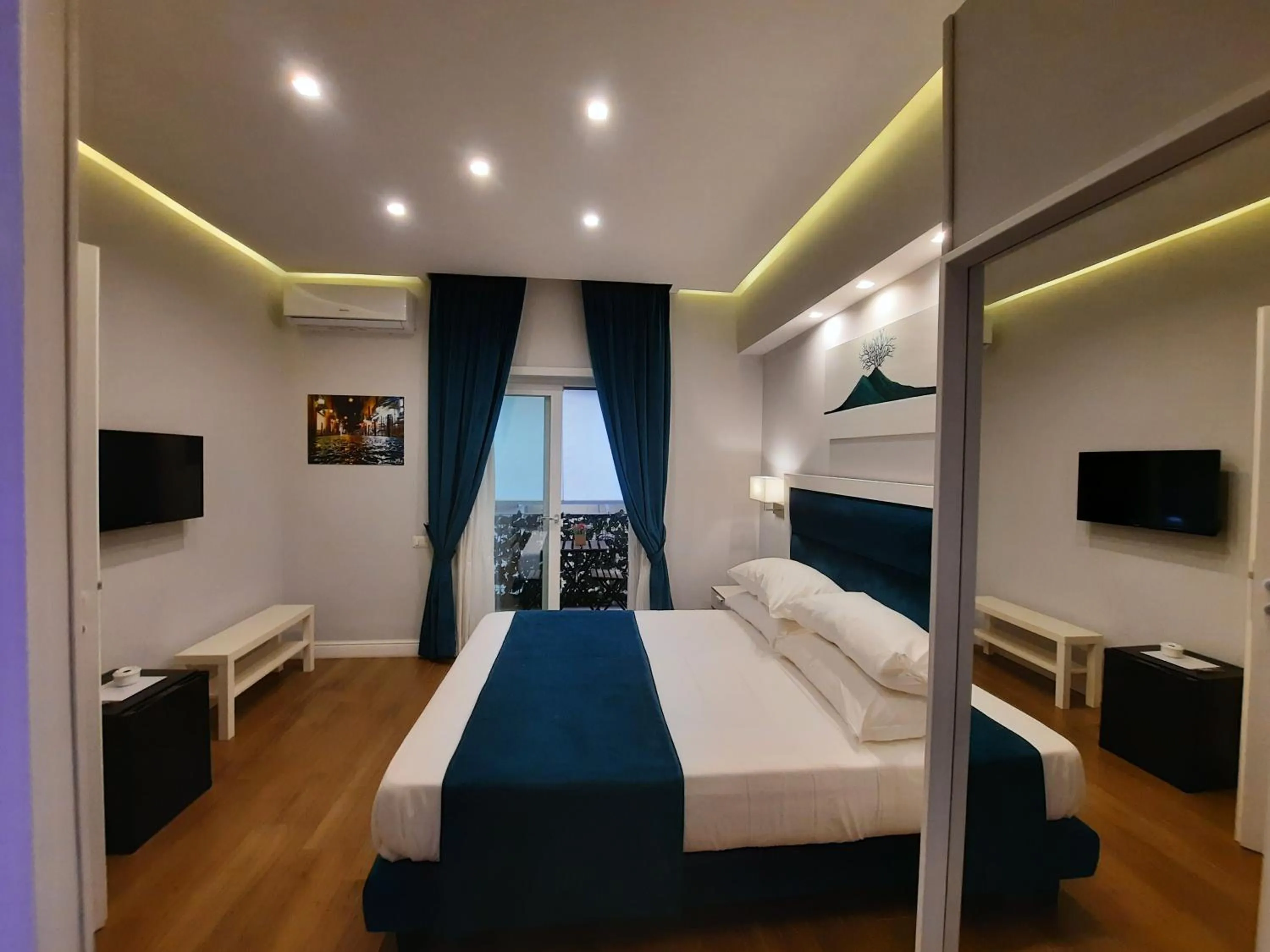 Photo of the whole room, Bed in Gea suite