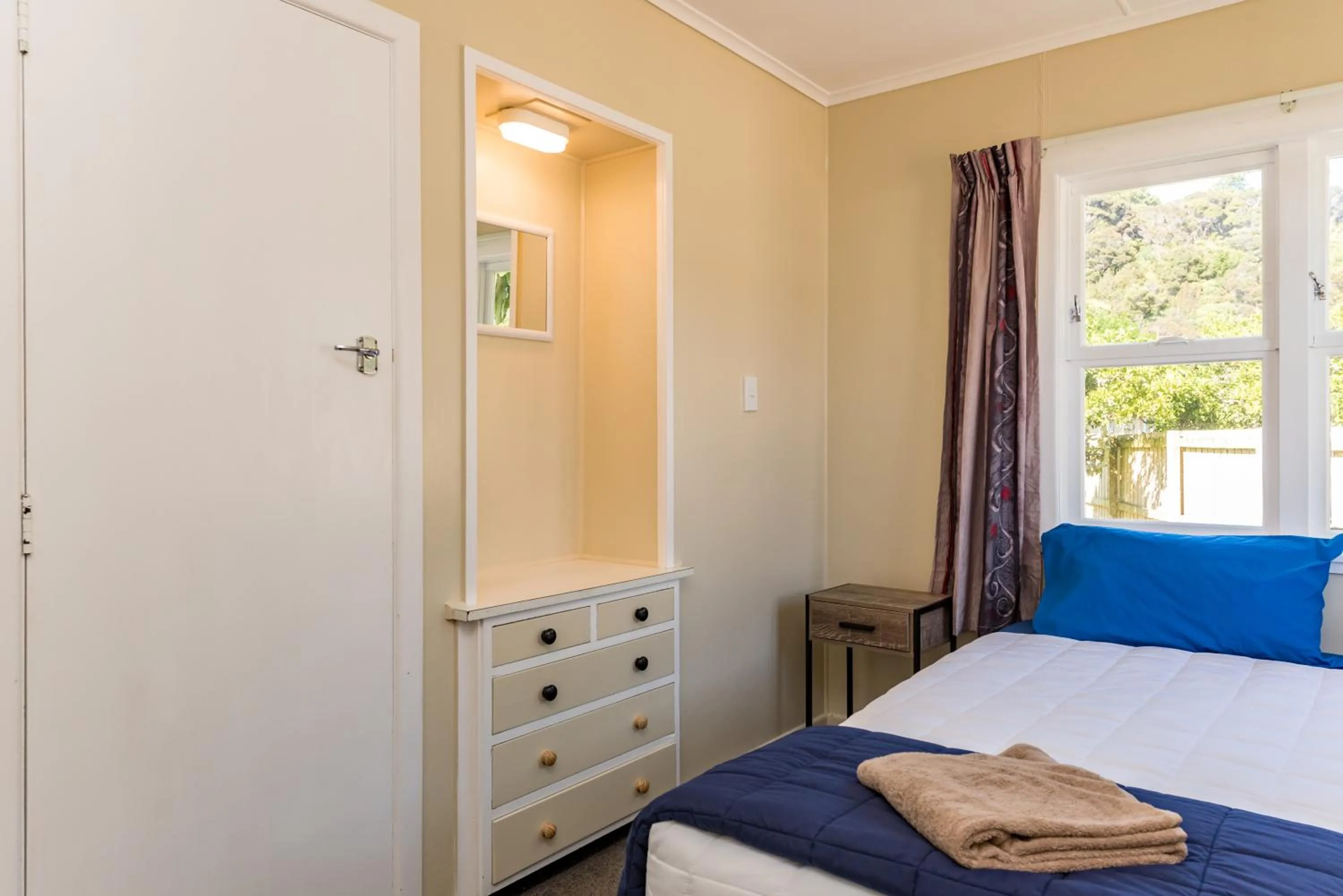 Bedroom in Waitangi Beach Bach 30B