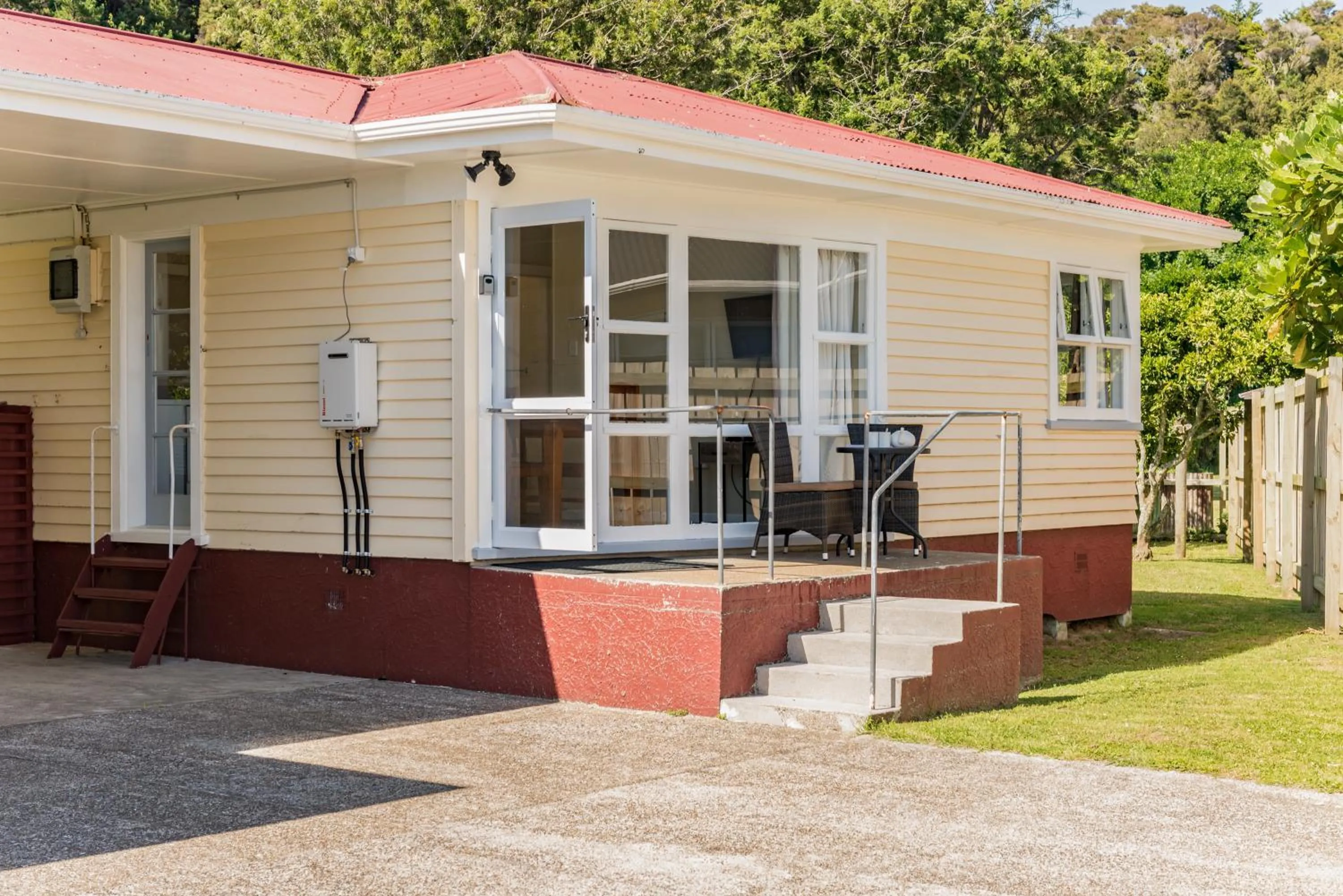 Facade/entrance in Waitangi Beach Bach 30B