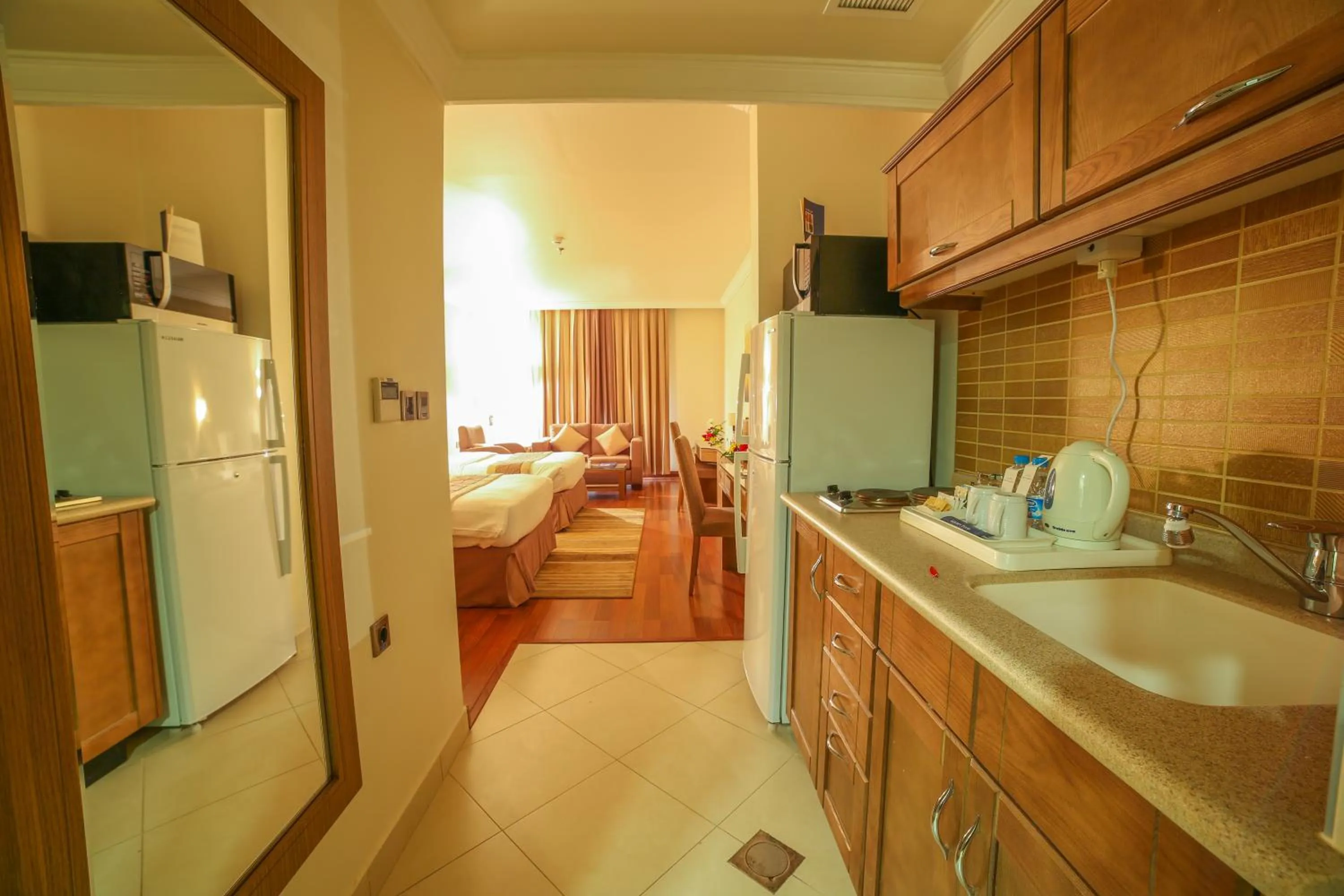 Kitchen or kitchenette in Golden Tulip Hotel Buraidah Al Qassim