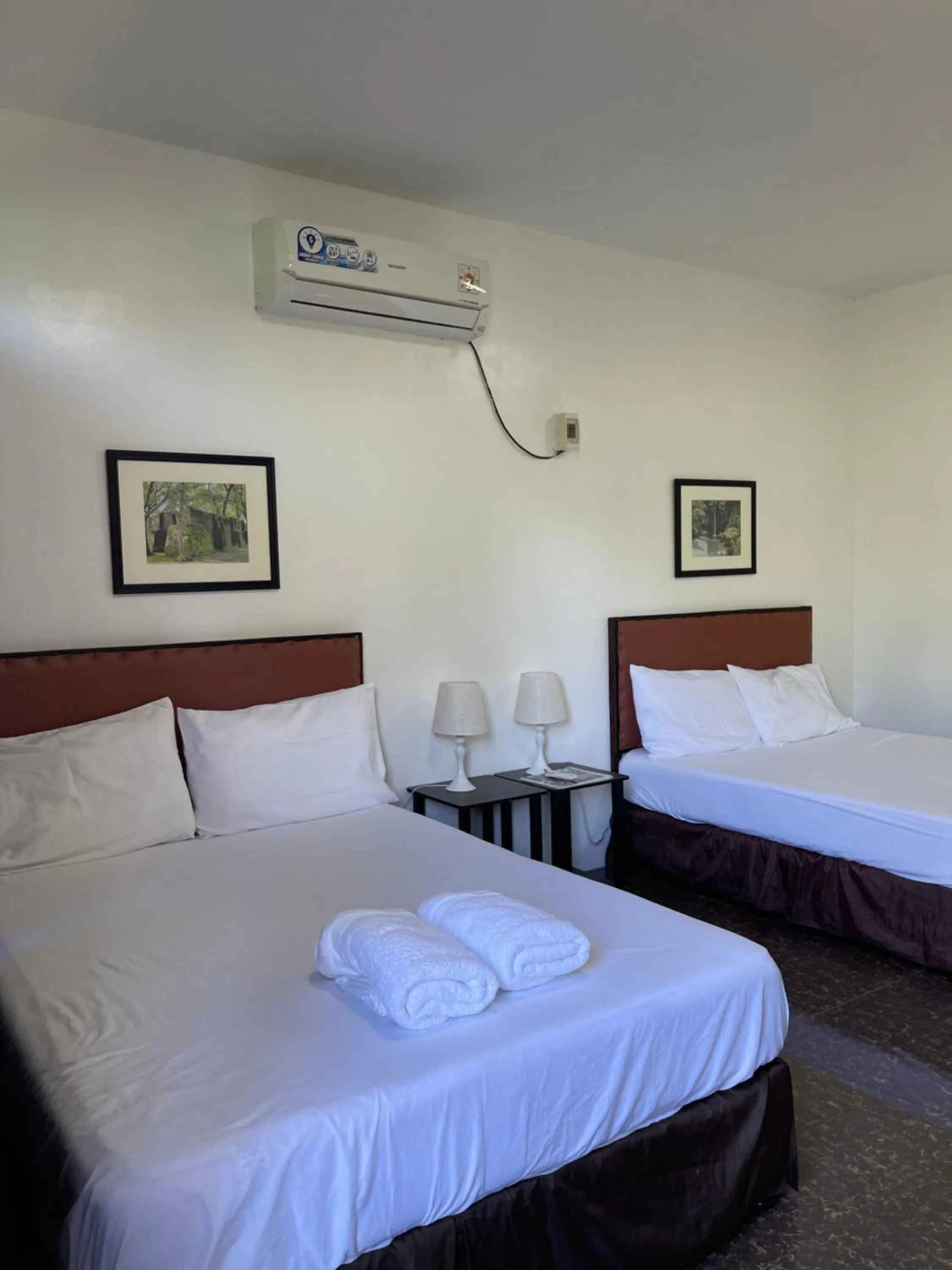 Bed in Seaside traveler's Inn by Camiguin Island Home