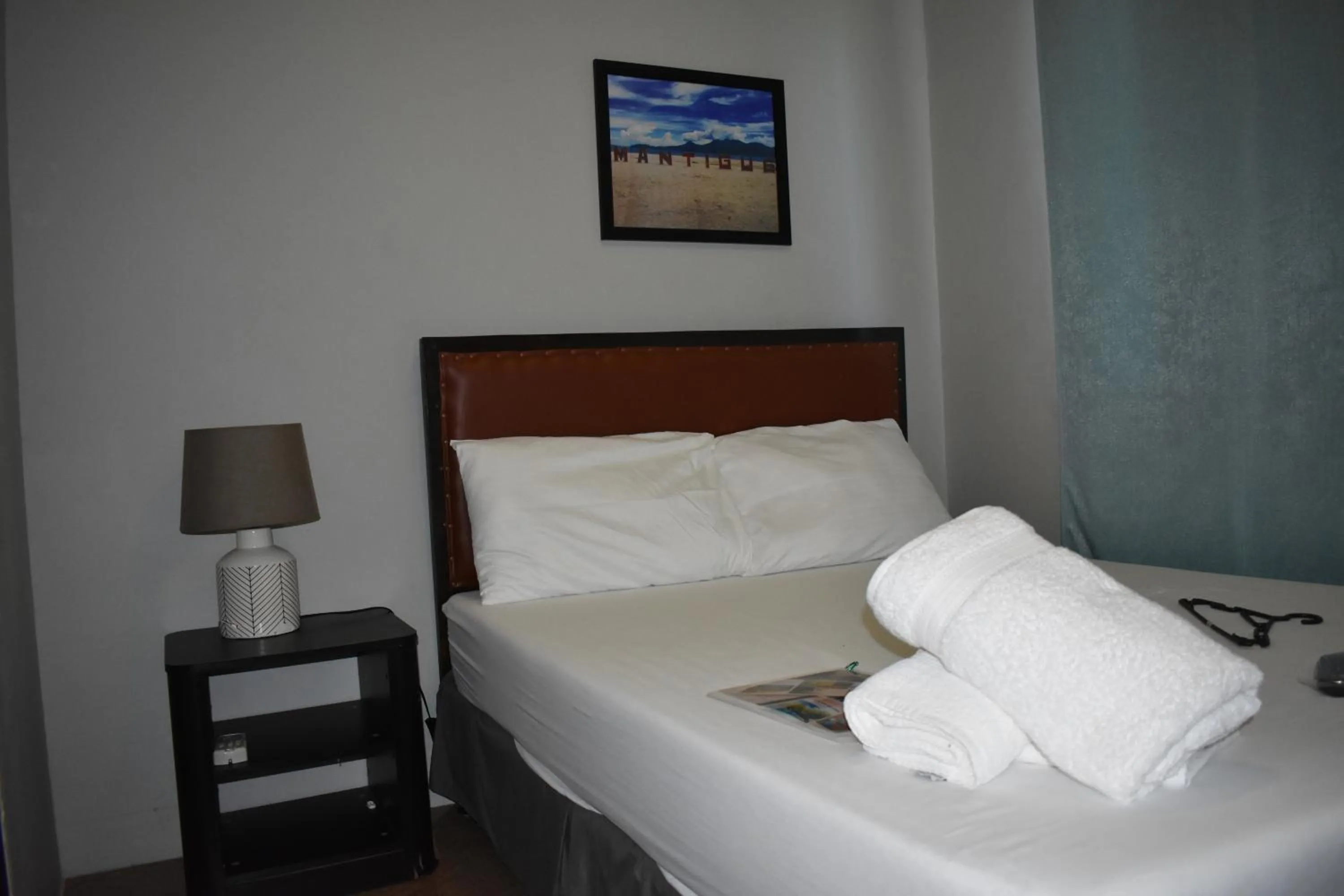 Bed in Seaside traveler's Inn by Camiguin Island Home