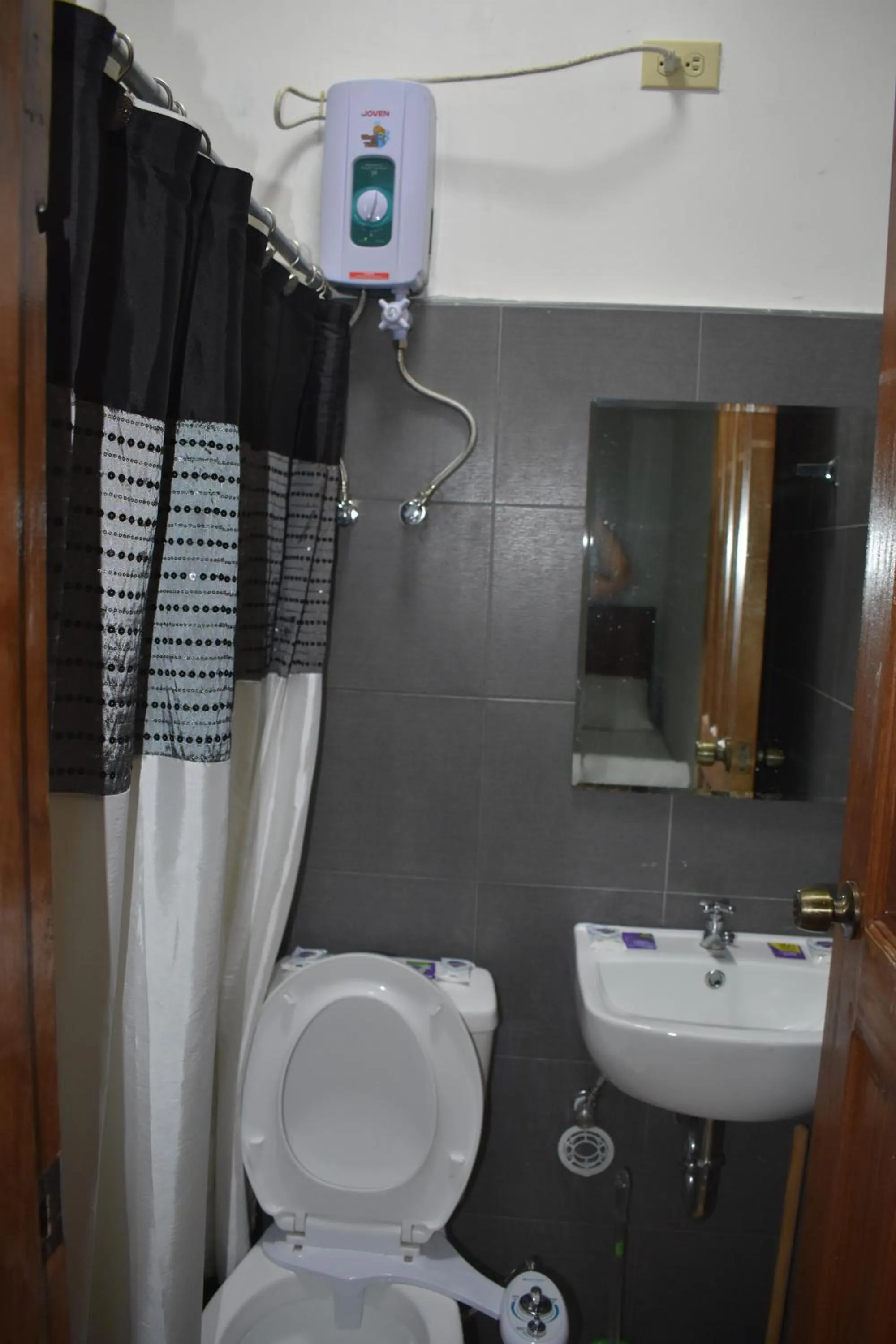 Bathroom in Seaside traveler's Inn by Camiguin Island Home