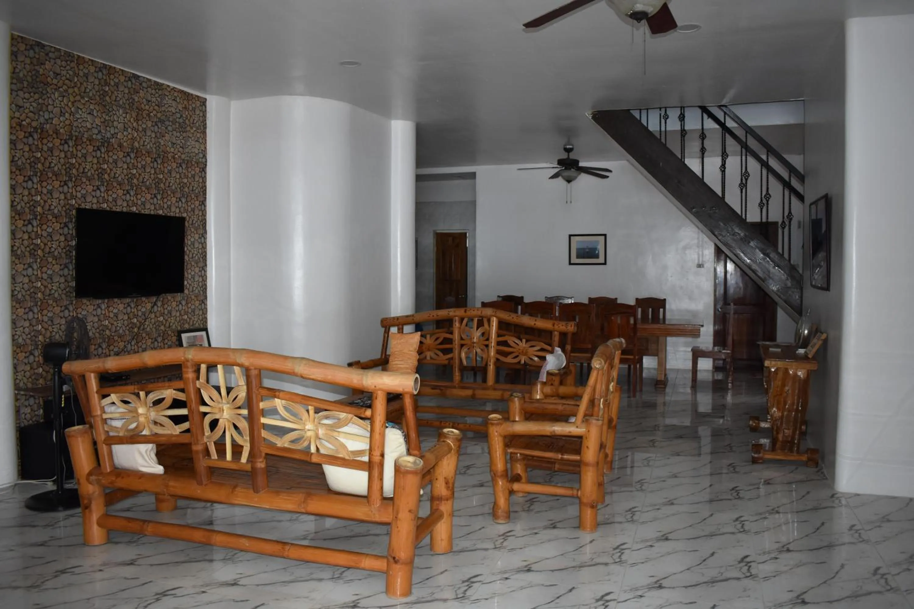 Living room in Seaside traveler's Inn by Camiguin Island Home