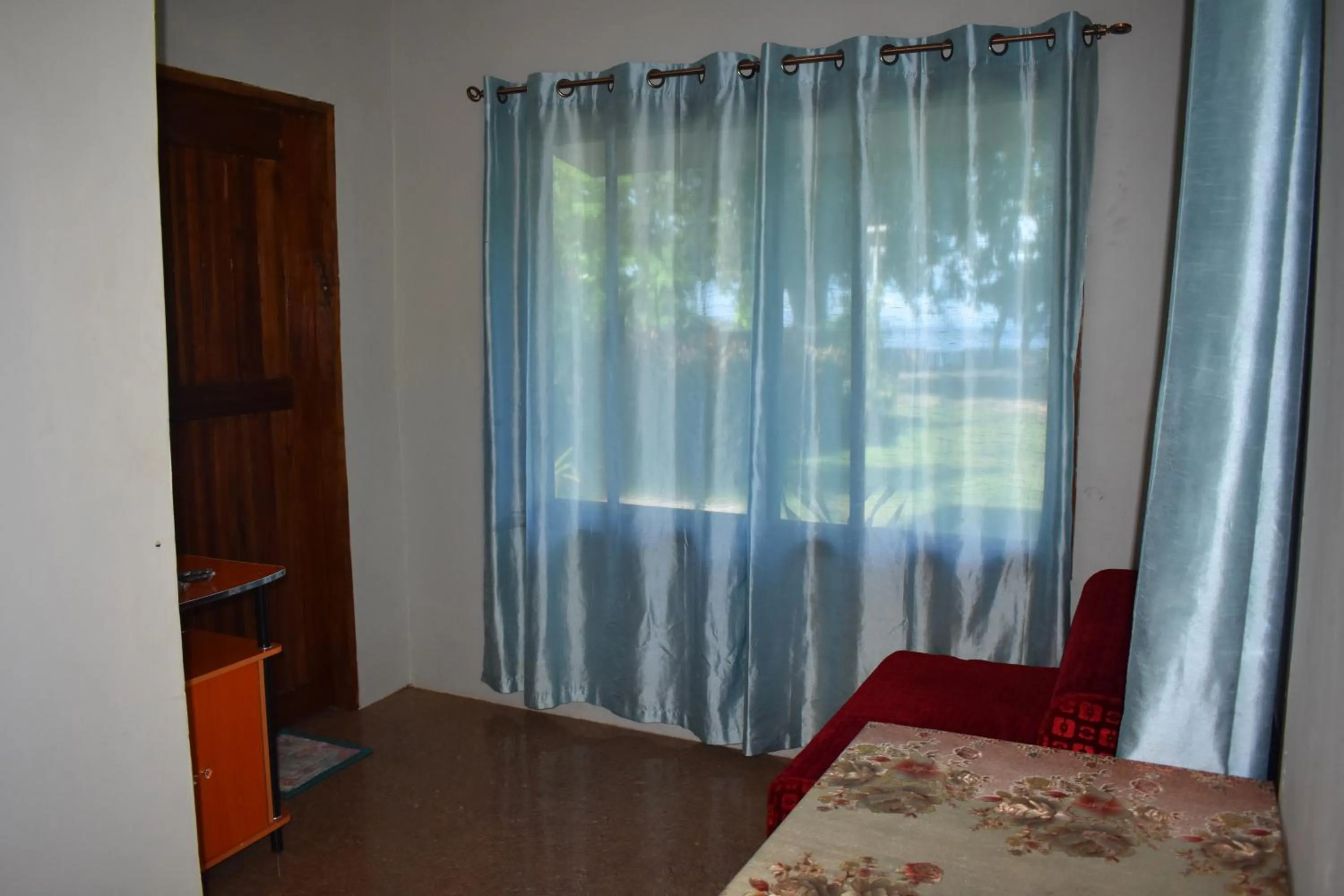 Living room, Bed in Seaside traveler's Inn by Camiguin Island Home