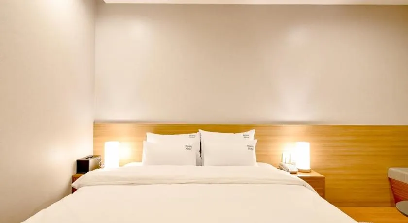 Bed in Blanc Business Hotel