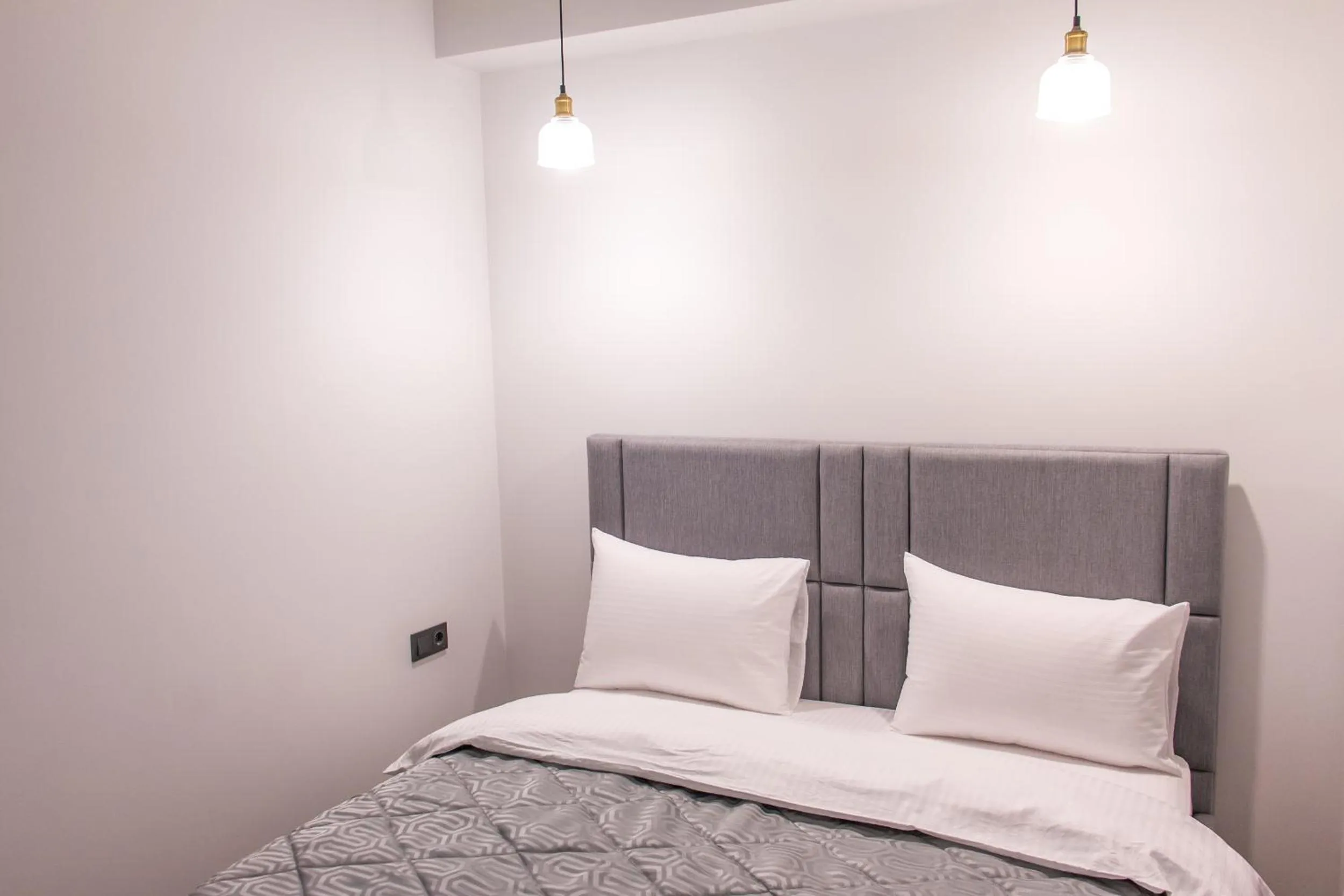 Bed in Opera Apartments Almaty