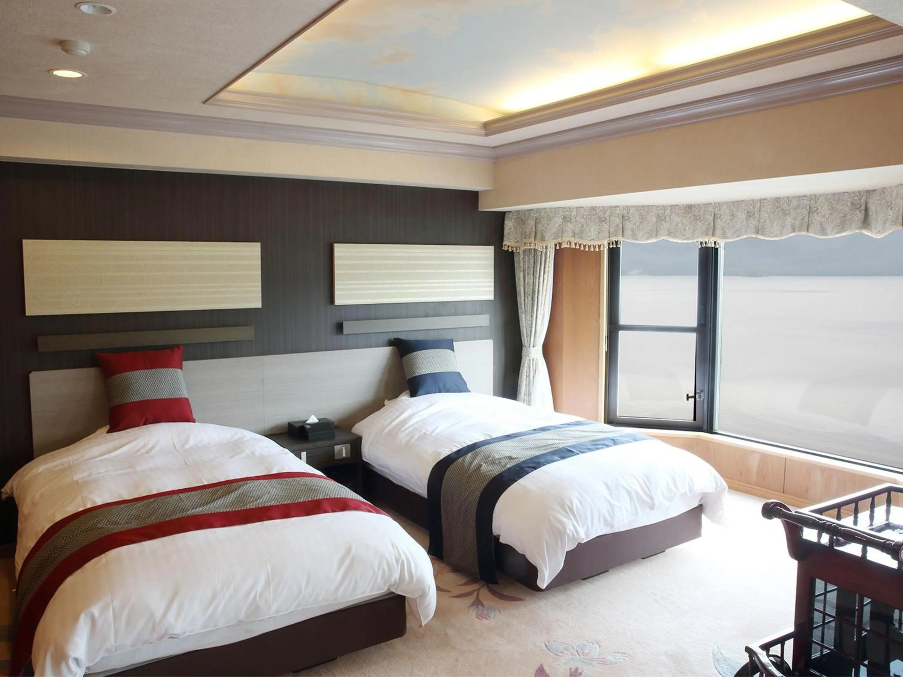 Bed in New Akan Hotel