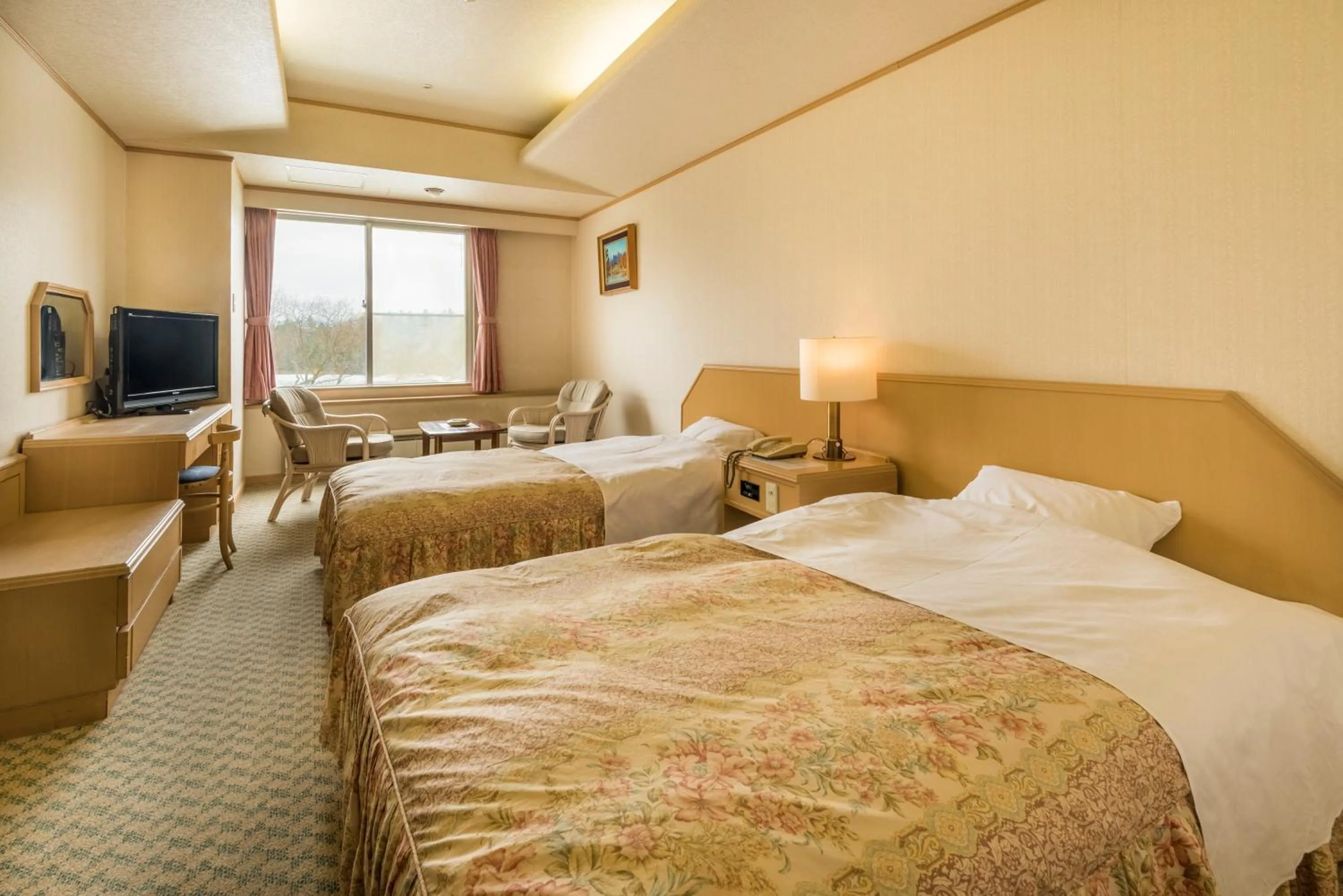 Photo of the whole room, Bed in New Akan Hotel