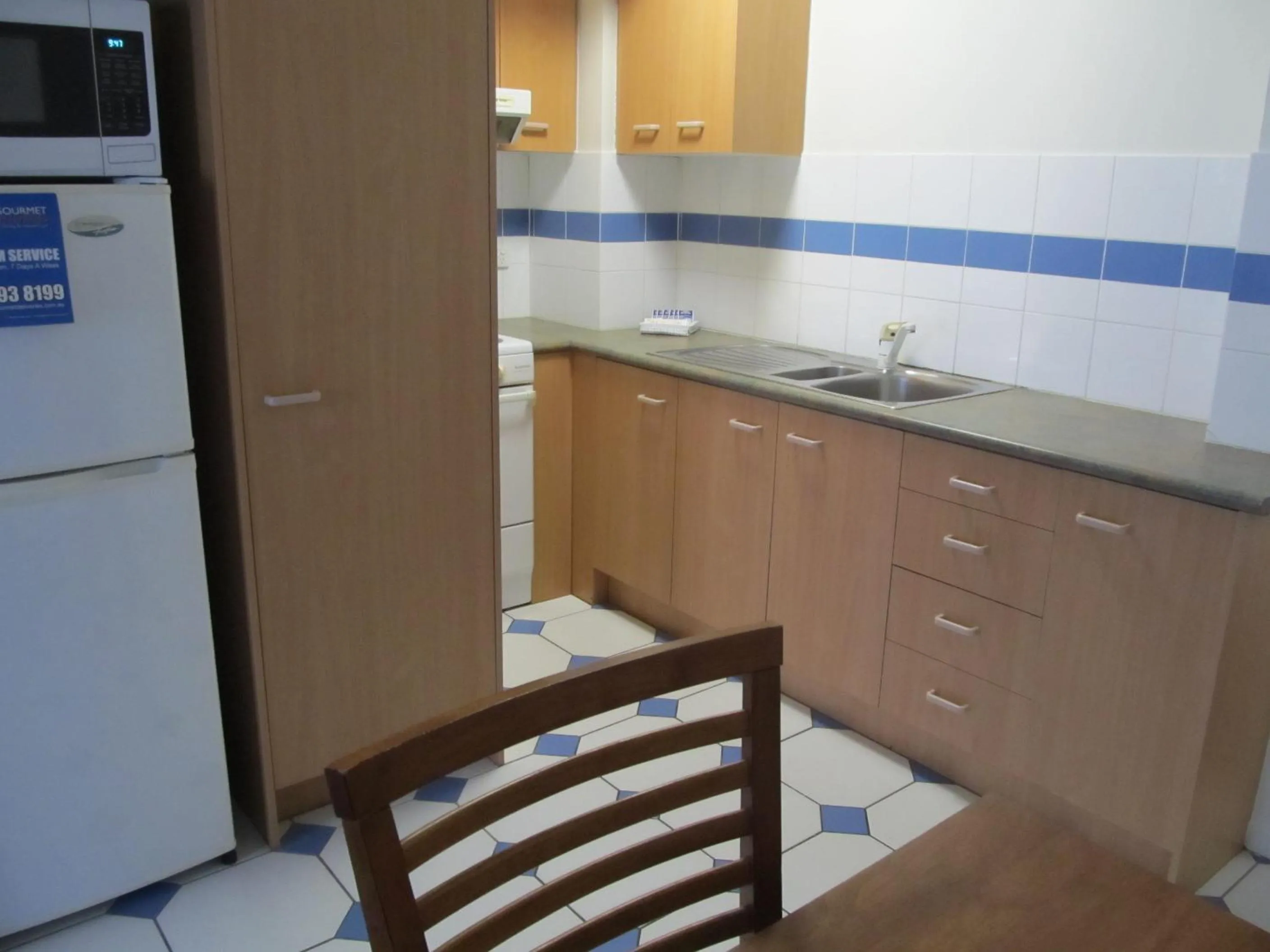 Kitchen or kitchenette in Costa D'Ora Holiday Apartments