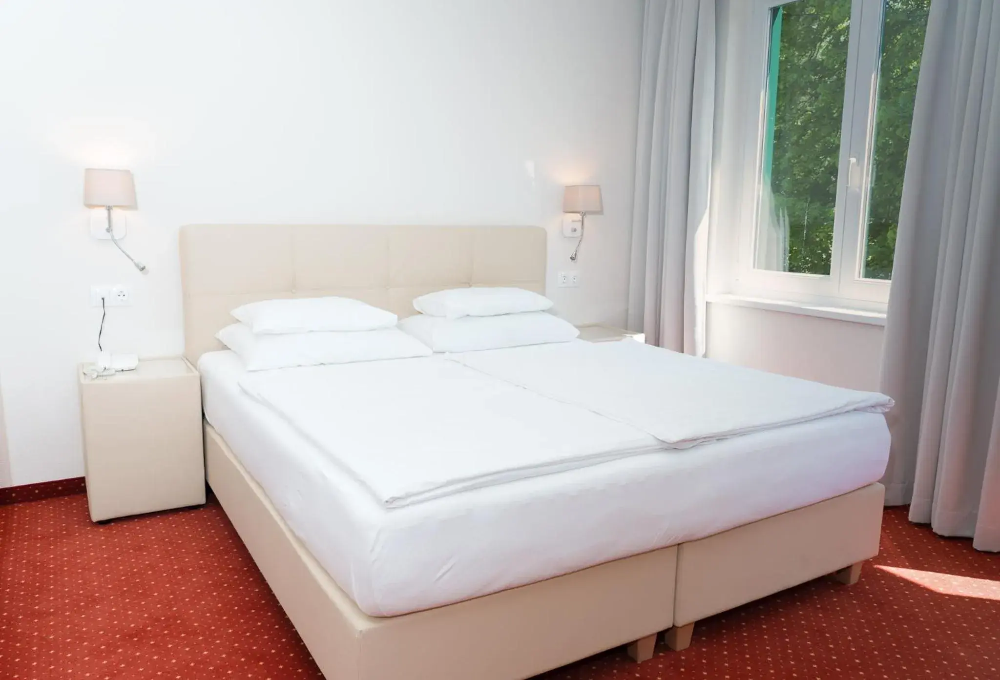 Bed in Inselhotel Faakersee