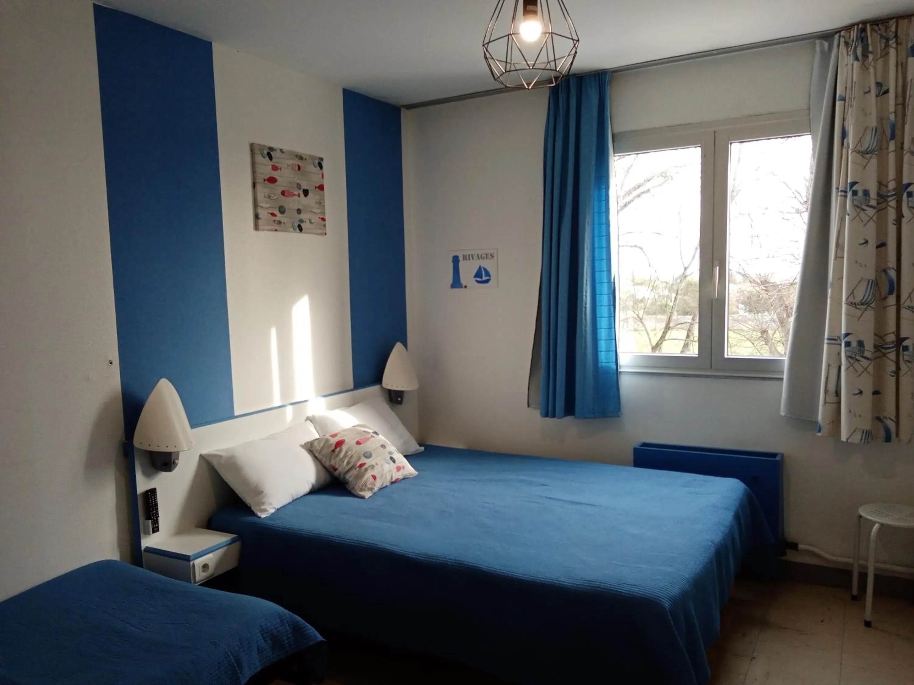 Bed in hotel l'échappée d'oléron