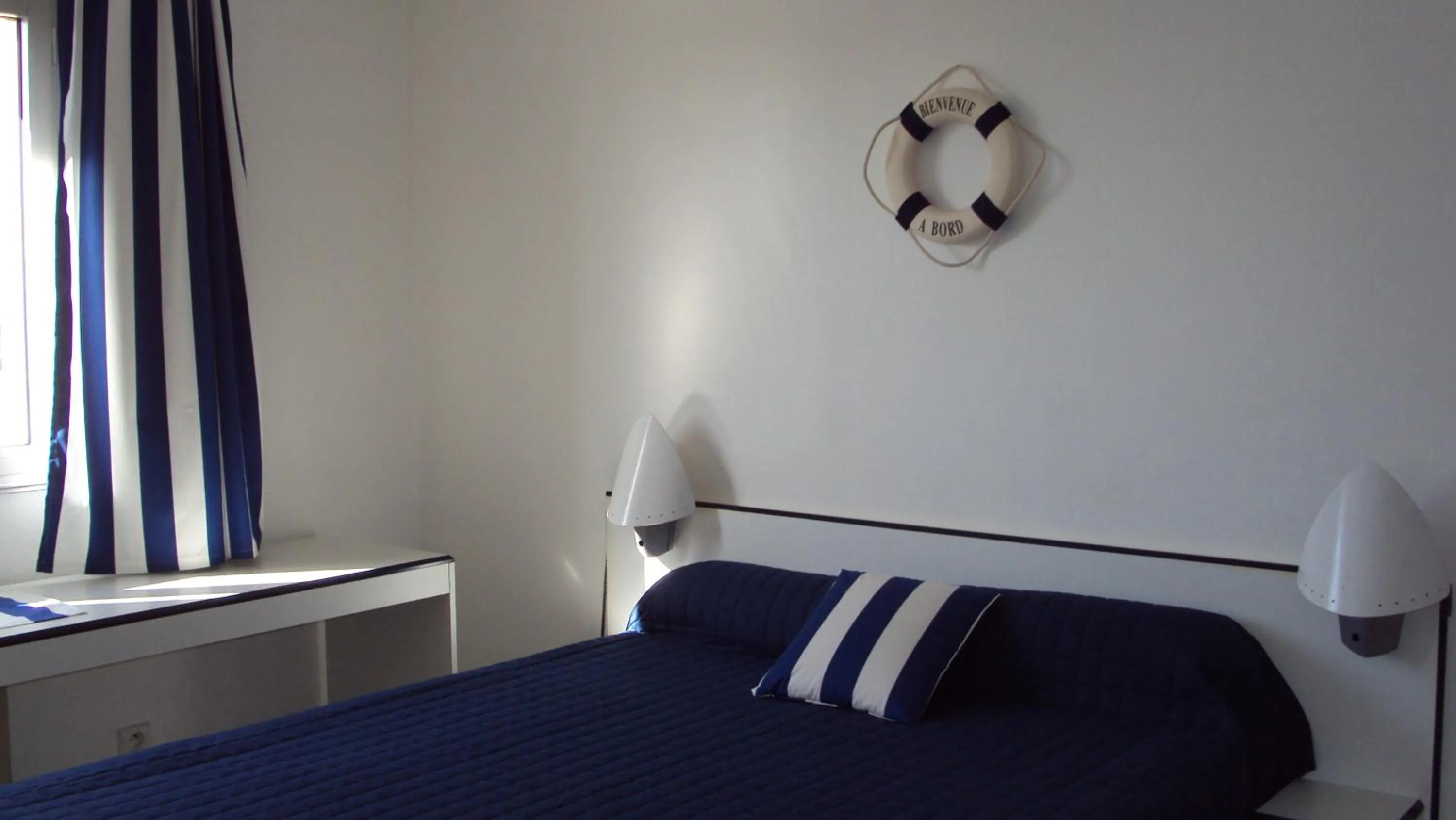 Bed in hotel l'échappée d'oléron