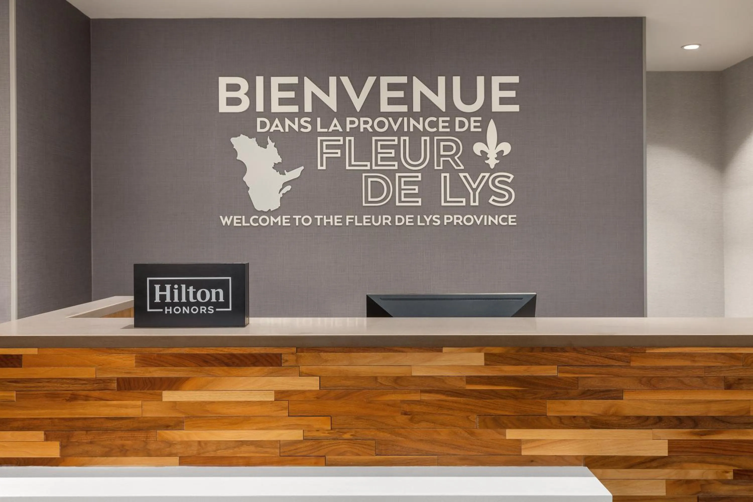 Property logo or sign in Hampton Inn & Suites Montreal-Dorval