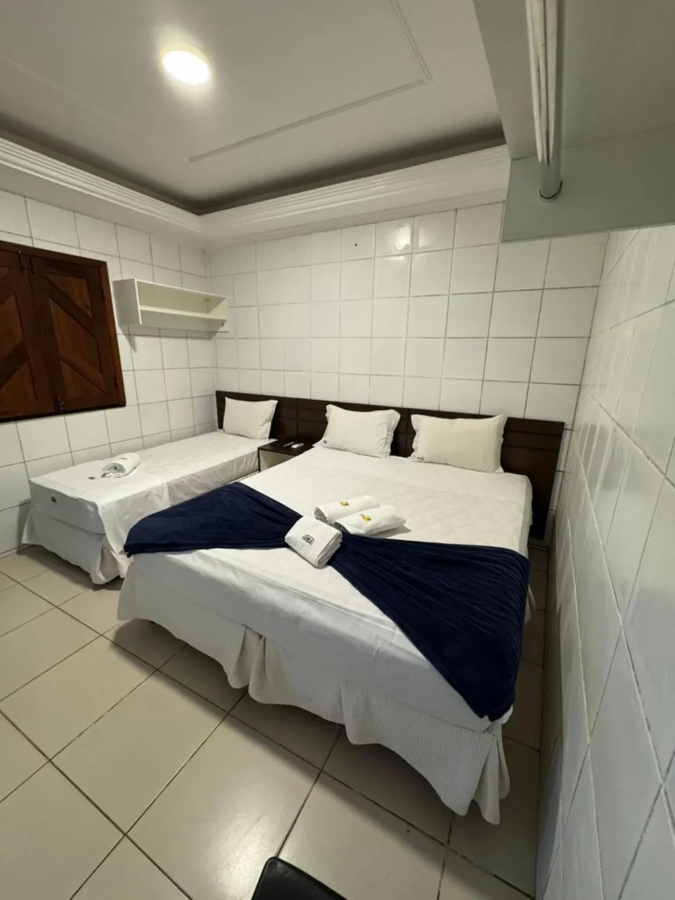 Bed in Pousada Tambaú