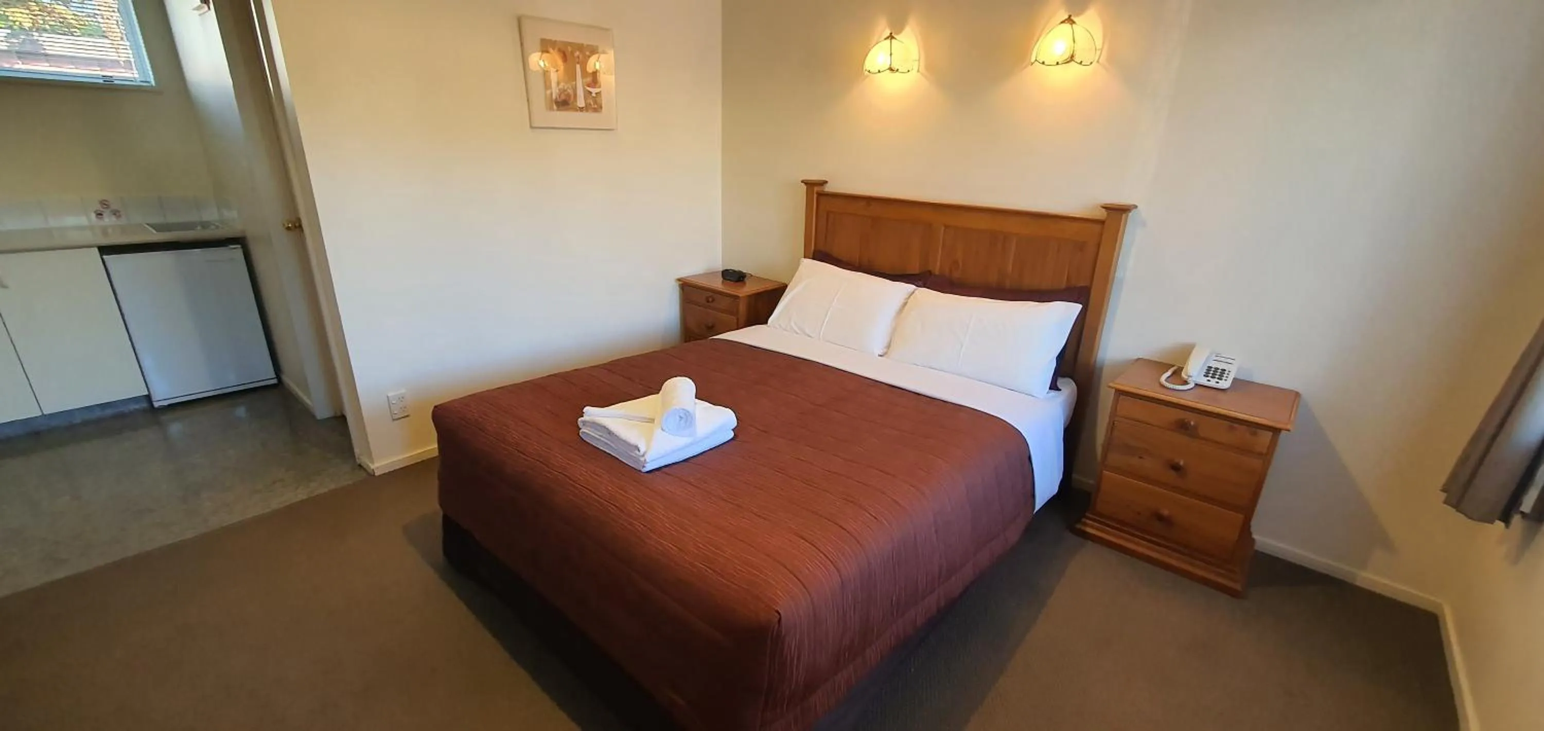 Bed in Rosewood Court Motel