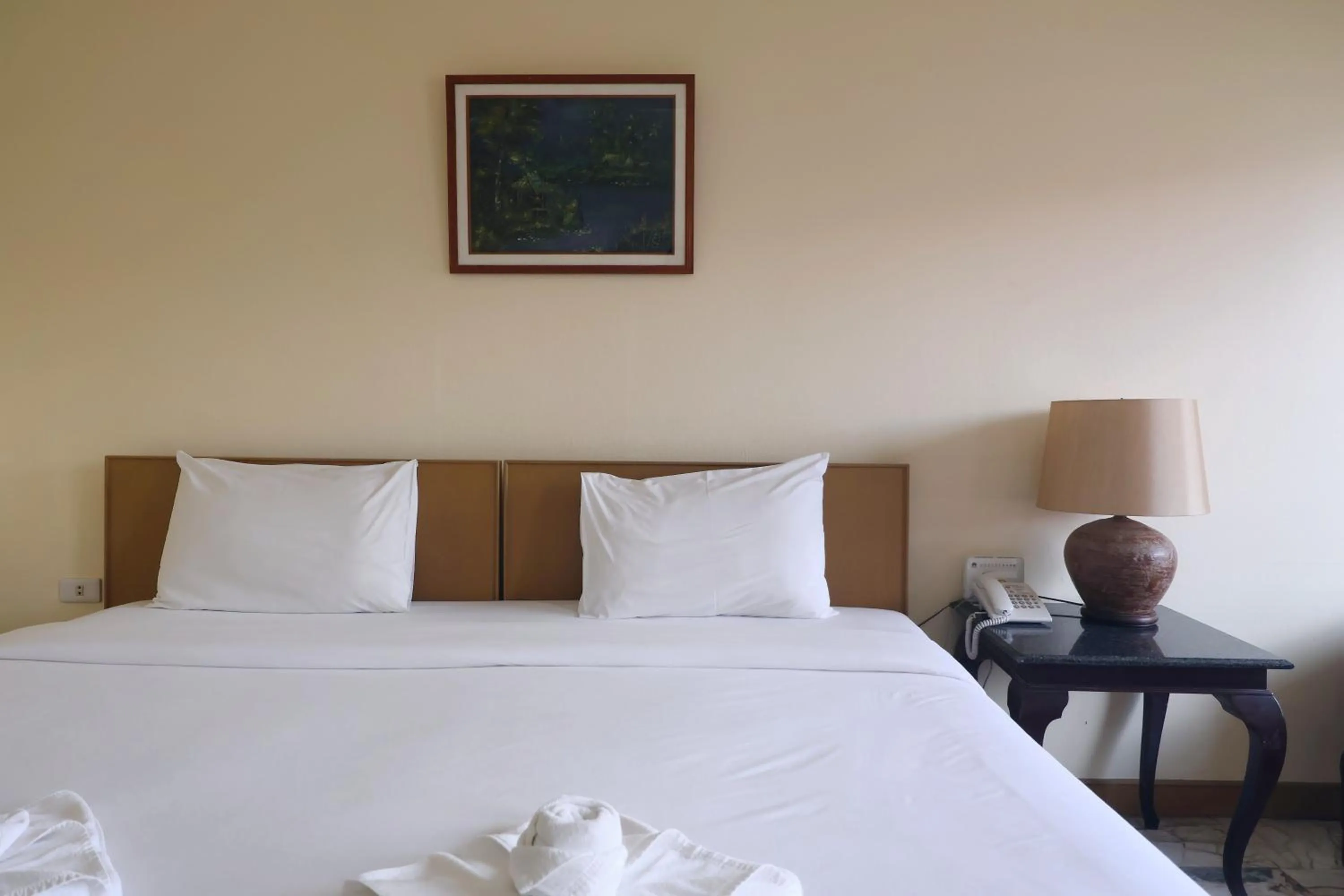 Bed in Nonthaburi Palace Hotel