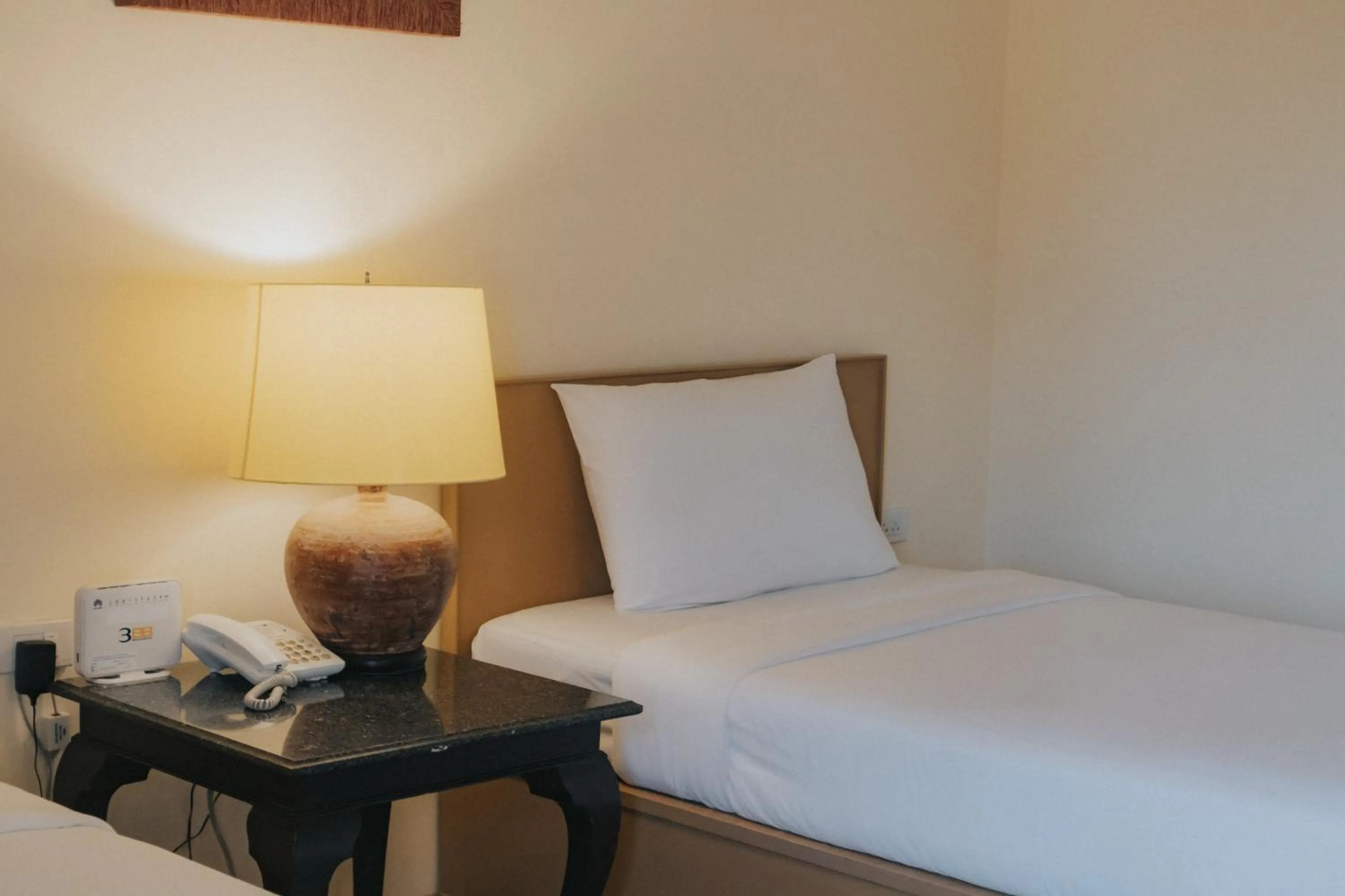 Bed in Nonthaburi Palace Hotel