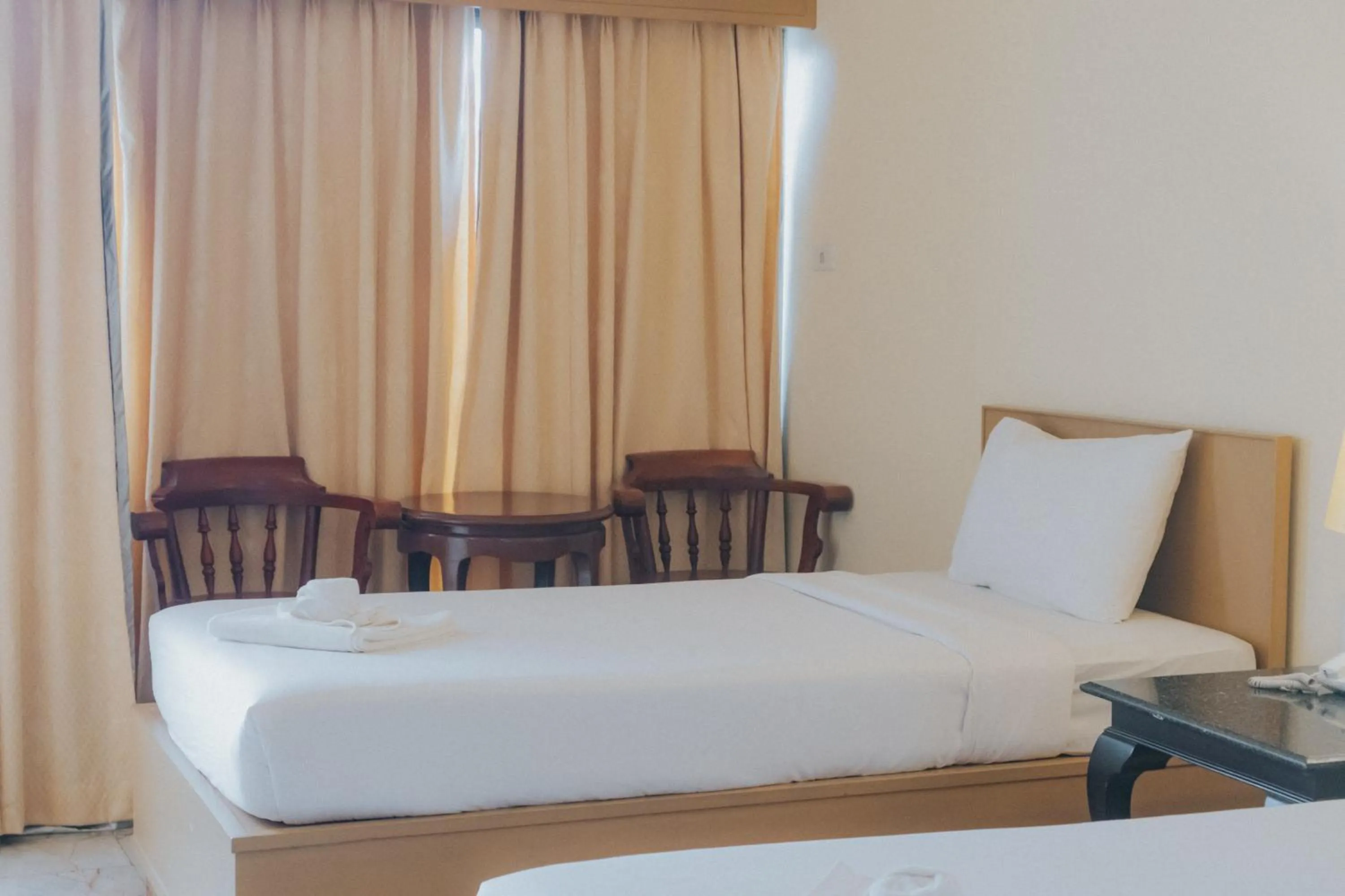 Bed in Nonthaburi Palace Hotel