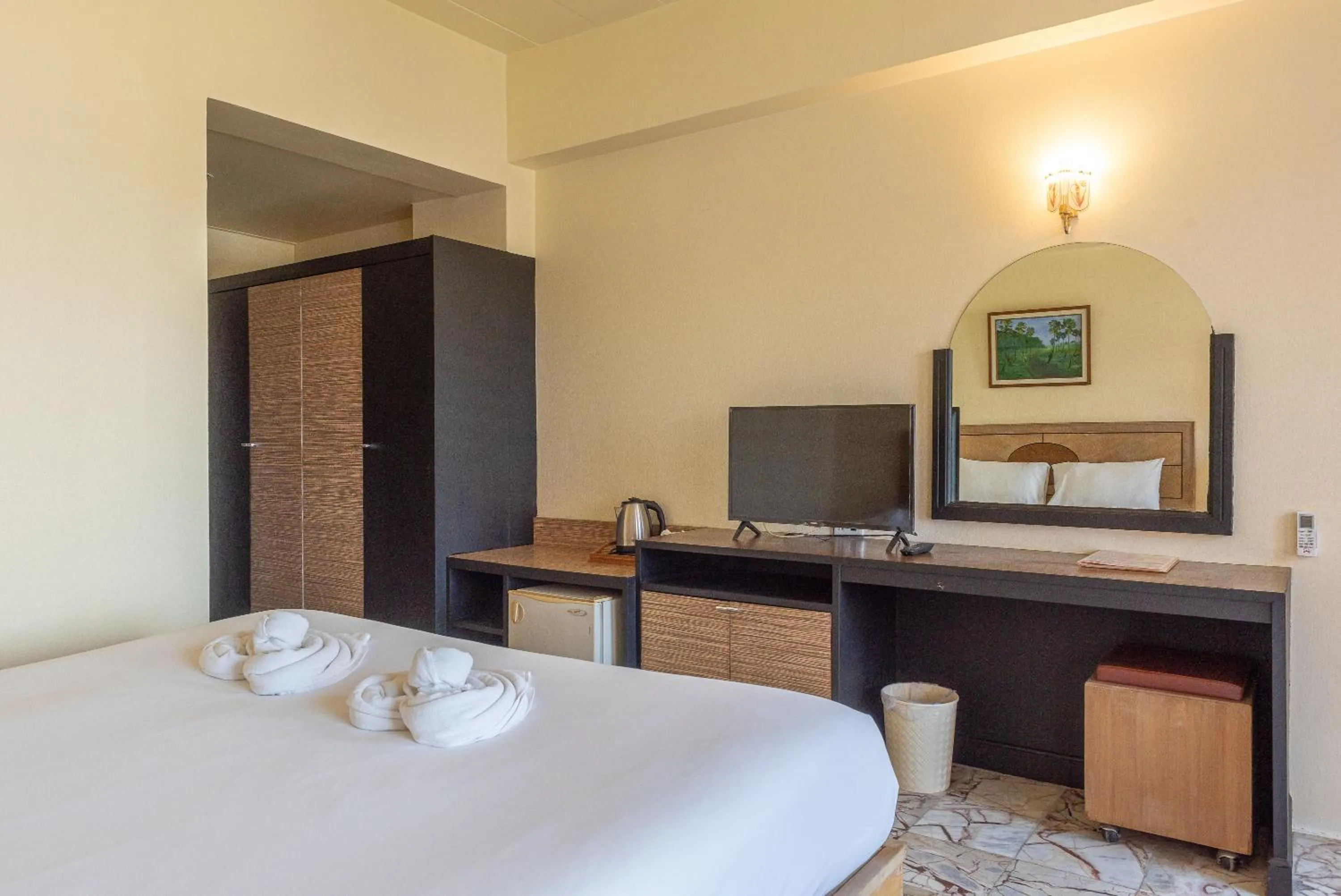 Bed in Nonthaburi Palace Hotel