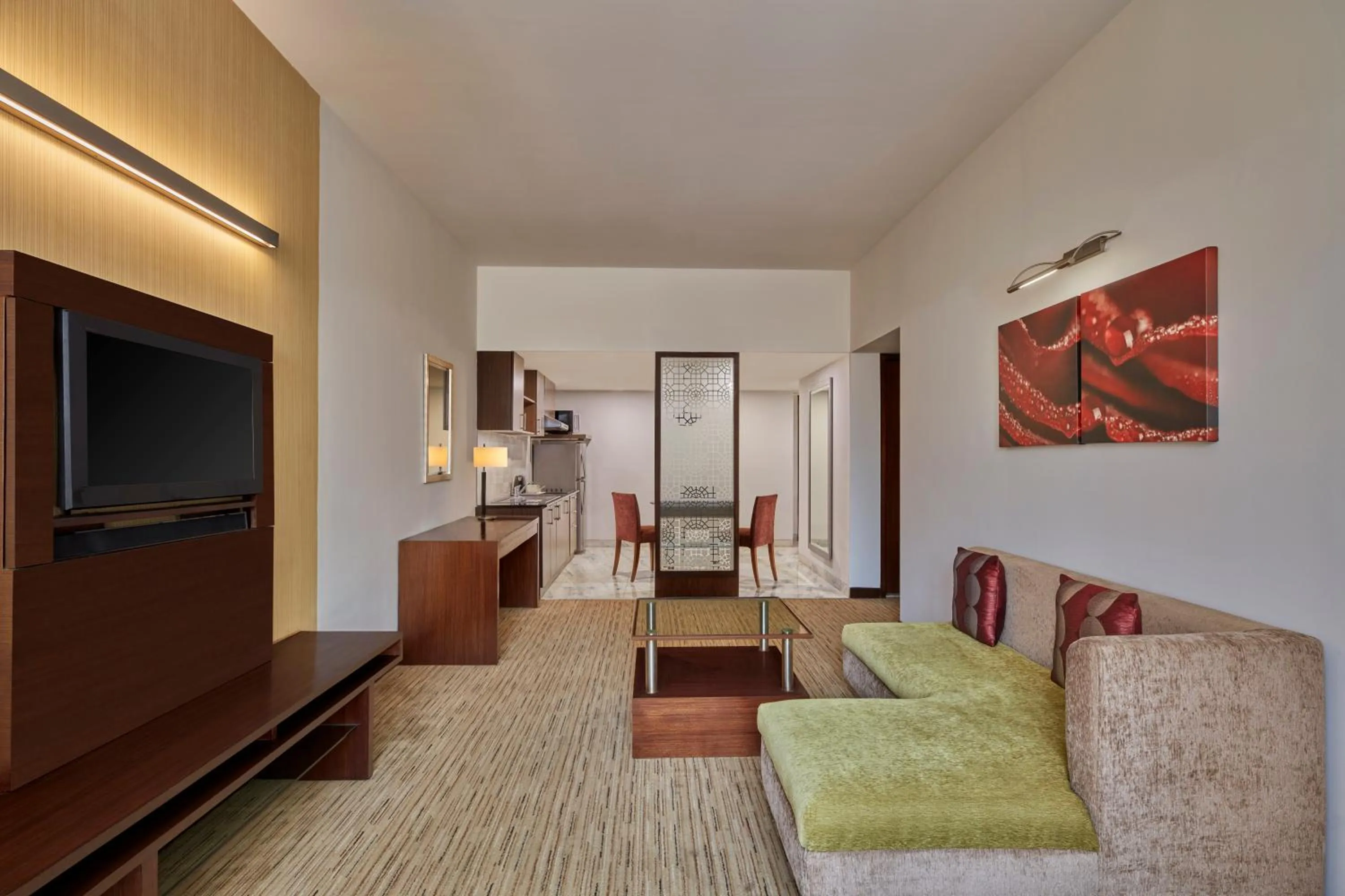 Living room, Bed in Four Points by Sheraton Hotel and Serviced Apartments Pune