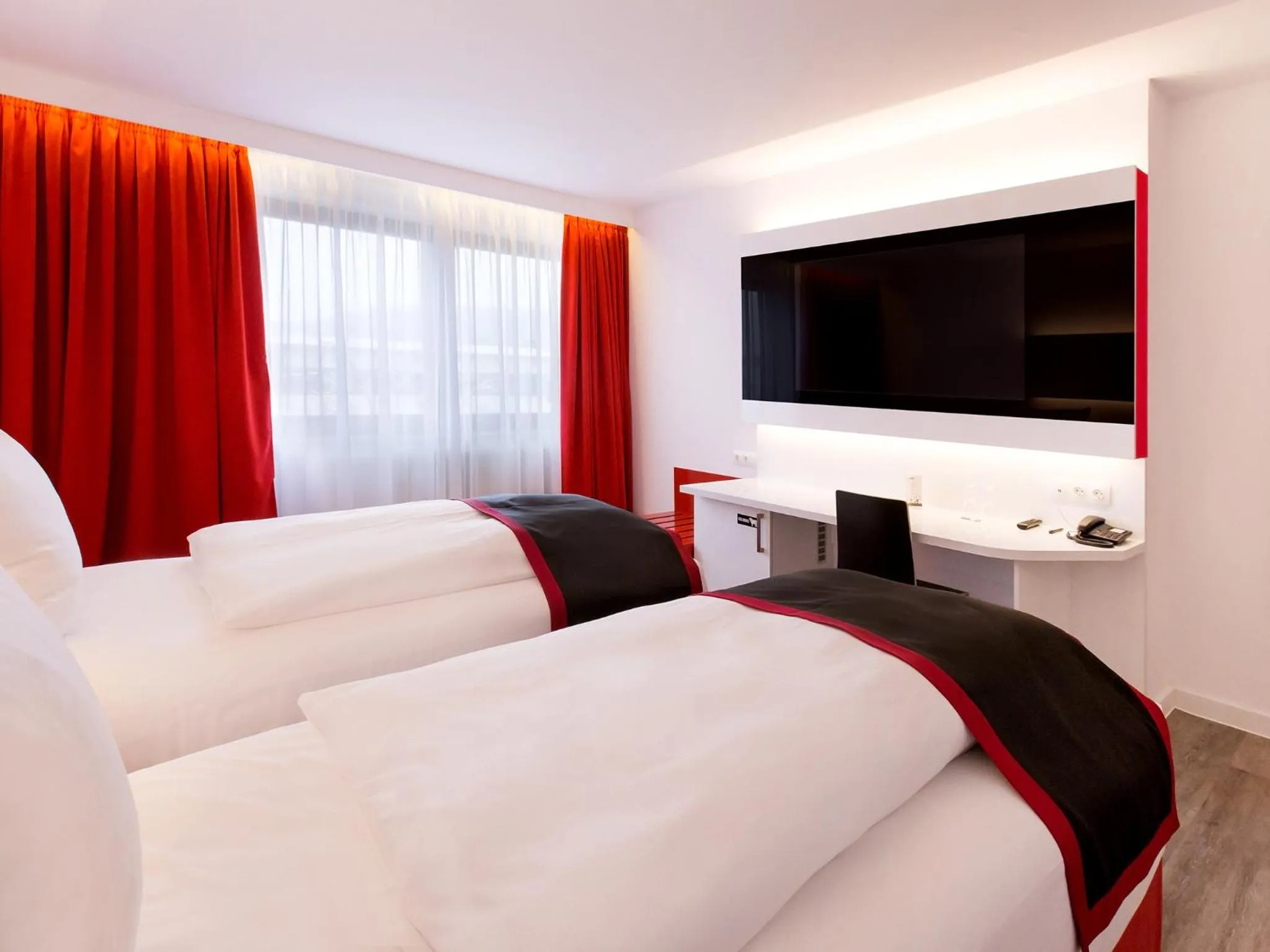 Photo of the whole room, Bed in DORMERO Hotel Burghausen