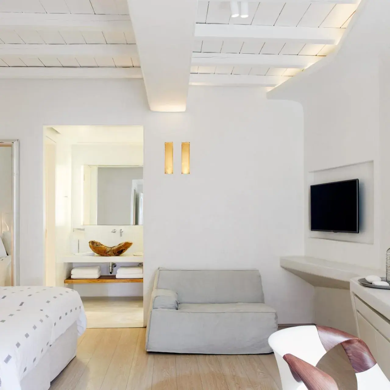 Communal lounge/ TV room, Bed in Cavo Tagoo Mykonos Communal lounge/ TV room, Bed in Cavo Tagoo Mykonos