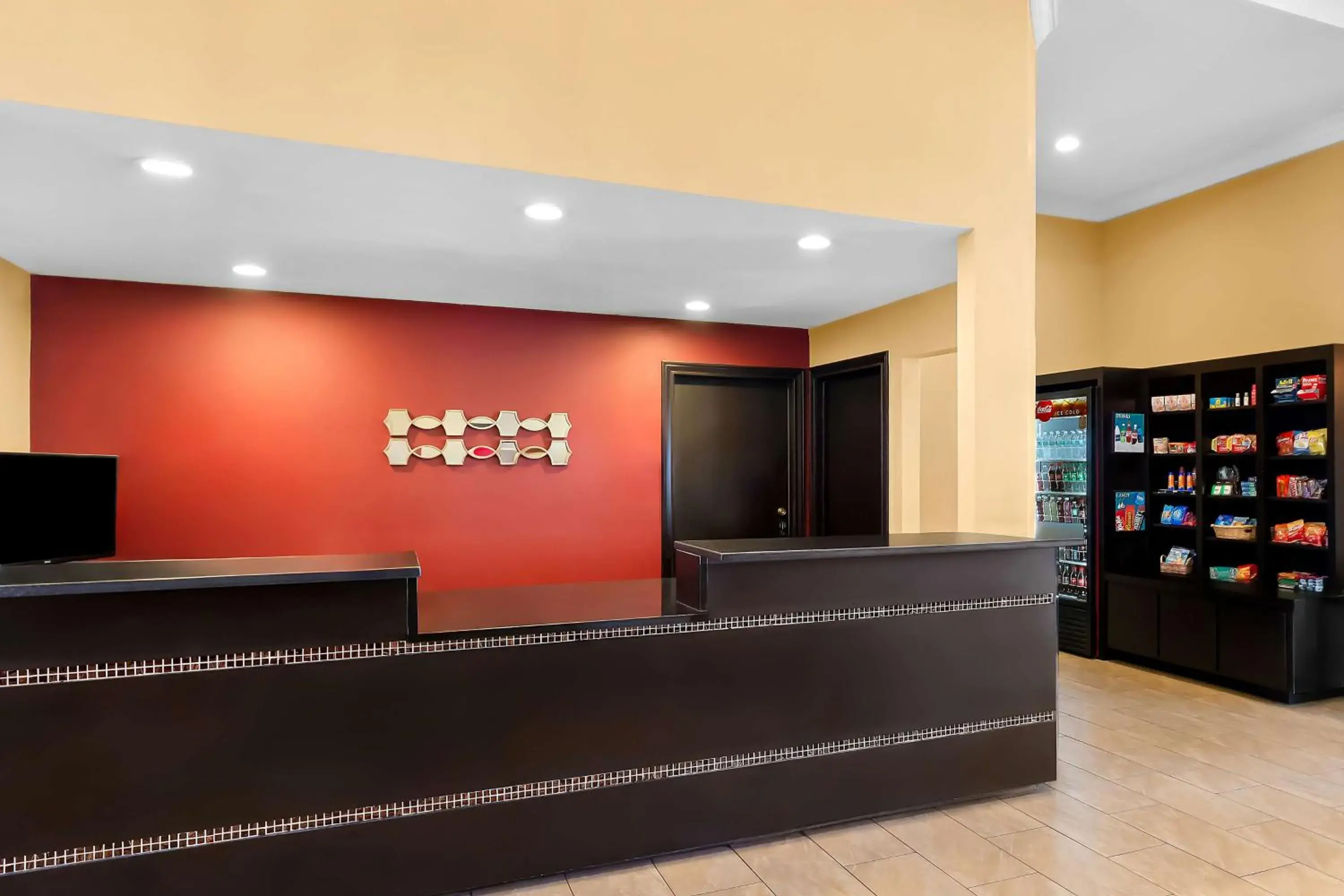Lobby or reception in SureStay Plus by Best Western San Antonio Fiesta Inn Lobby or reception in SureStay Plus by Best Western San Antonio Fiesta Inn