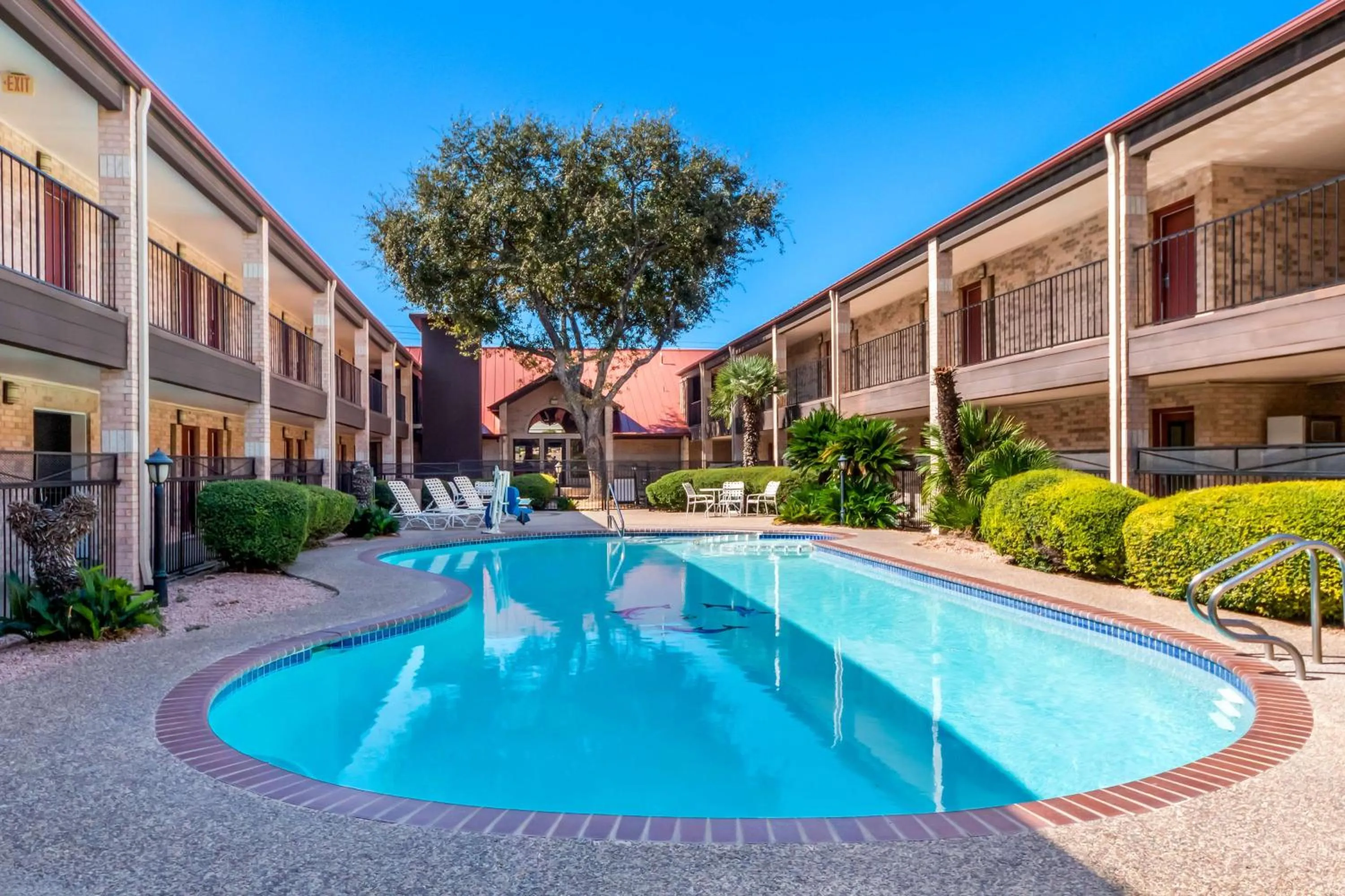 Pool view in SureStay Plus by Best Western San Antonio Fiesta Inn