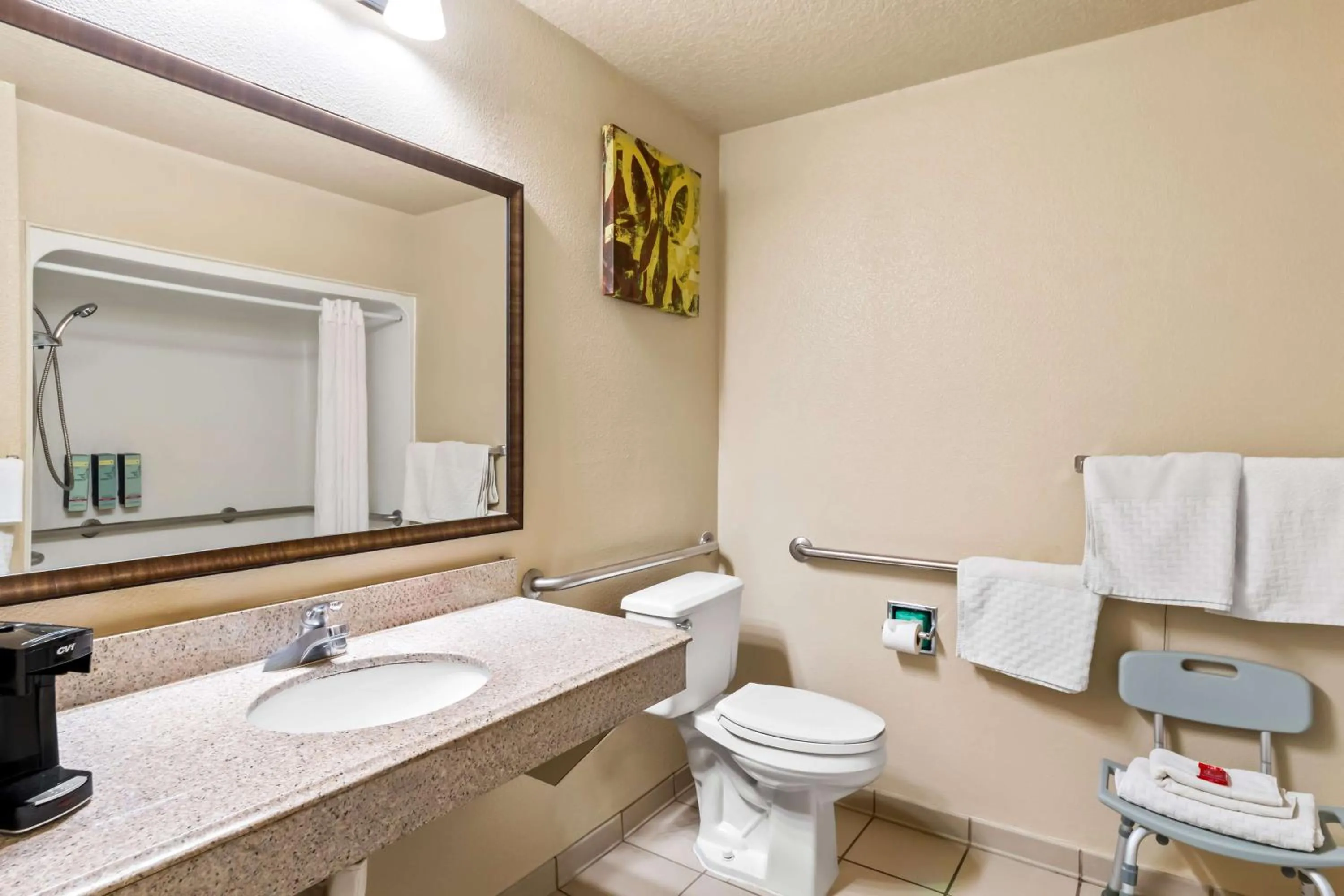 Bathroom in SureStay Plus by Best Western San Antonio Fiesta Inn
