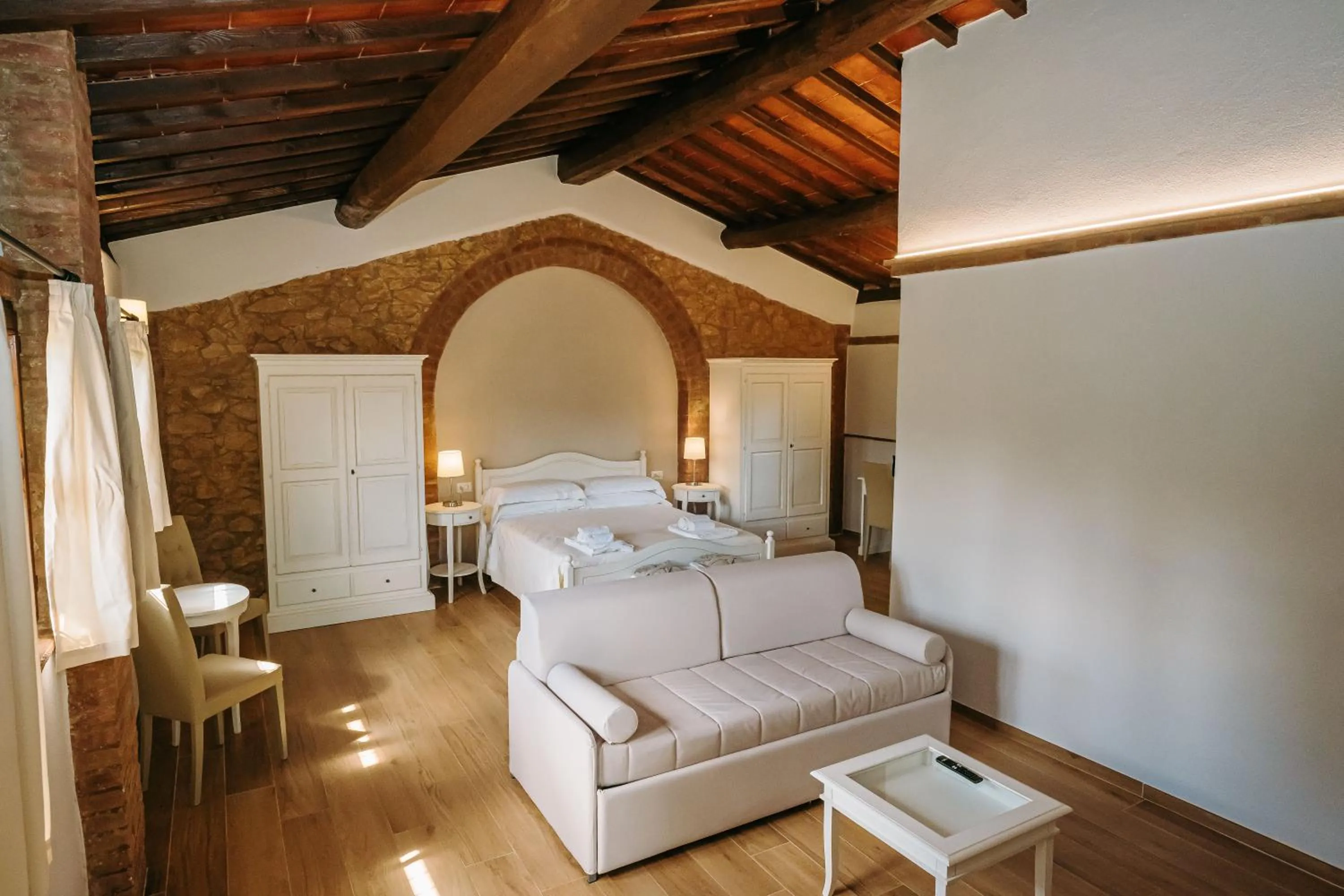 Living room, Bed in Borgo Il Poggiaccio Residenza Turistico Alberghiera