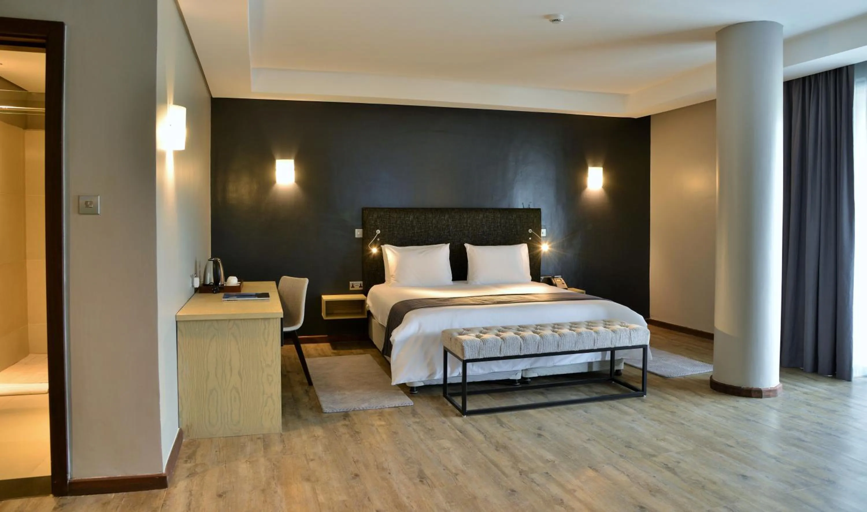 Photo of the whole room, Bed in EPIC Hotel & Suites