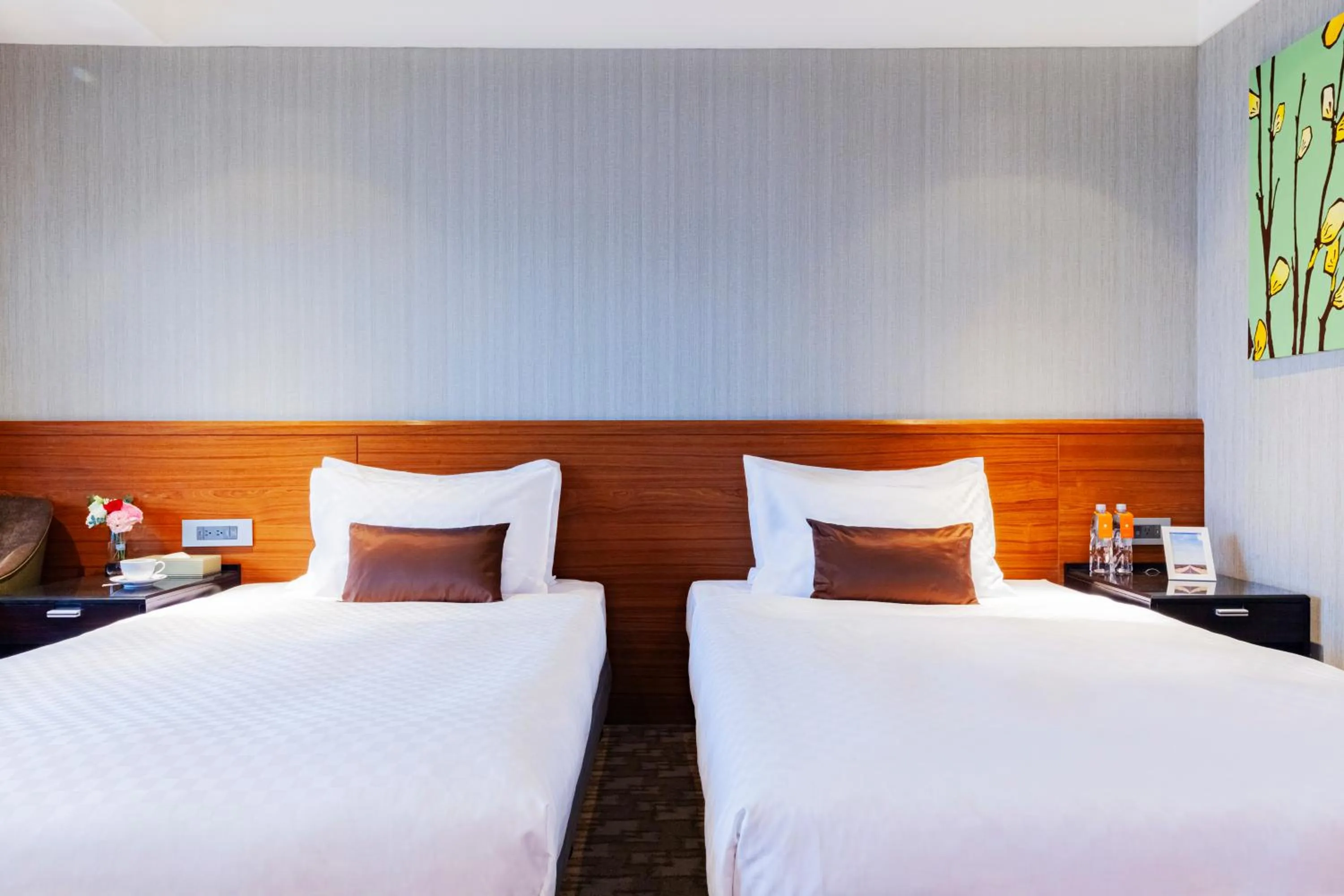 Bed in Pacific Business Hotel