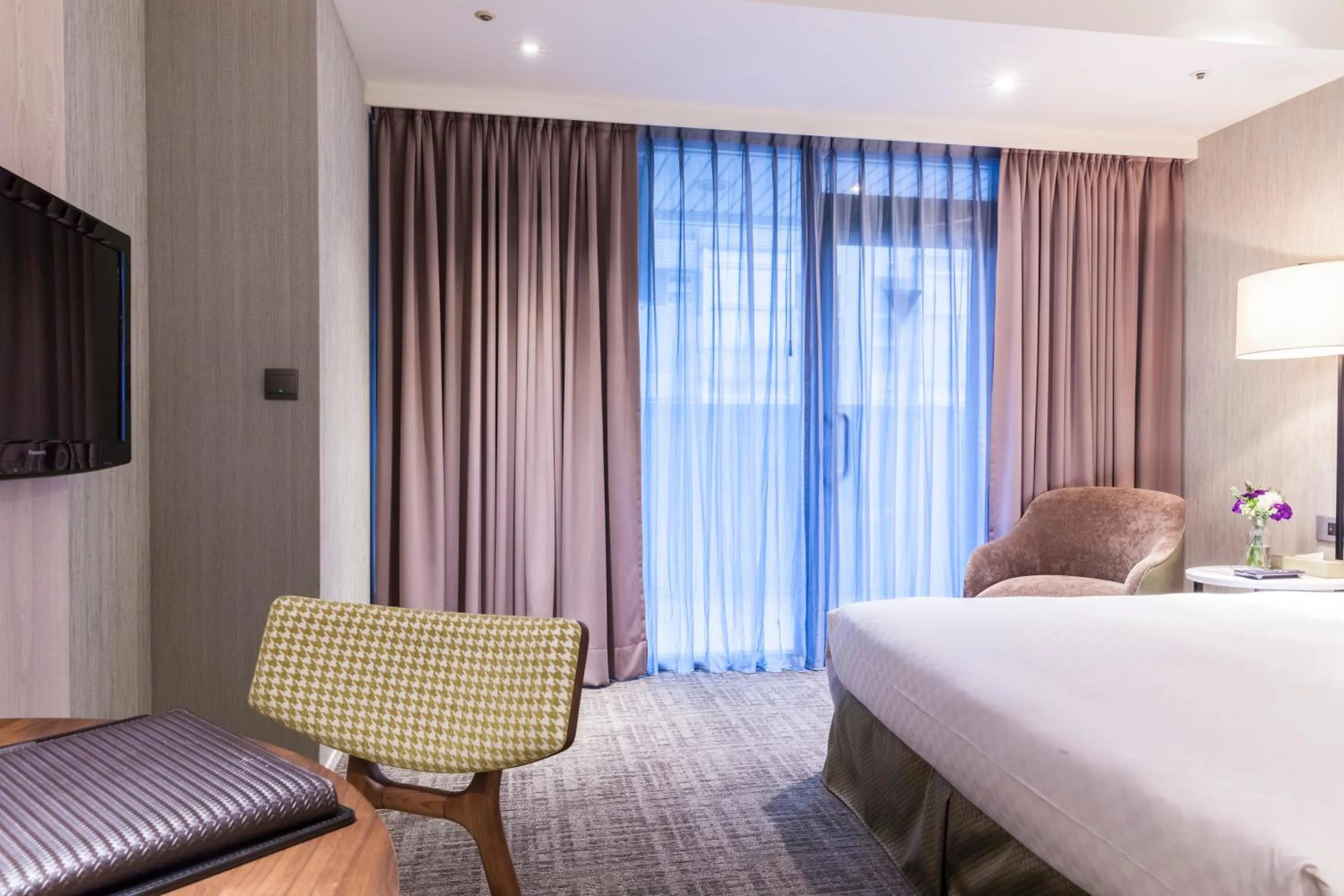 Bed in Pacific Business Hotel