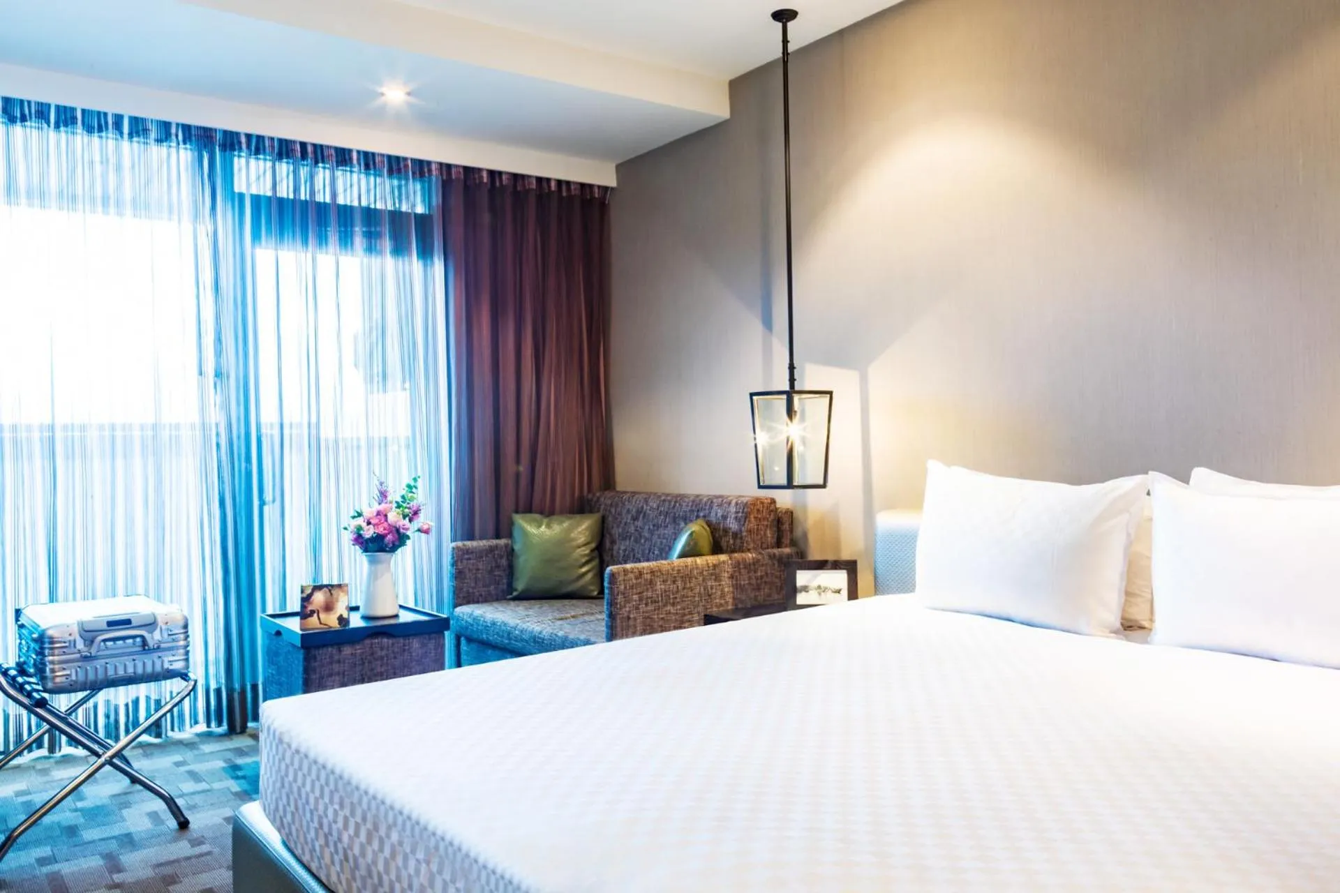 Bed in Pacific Business Hotel