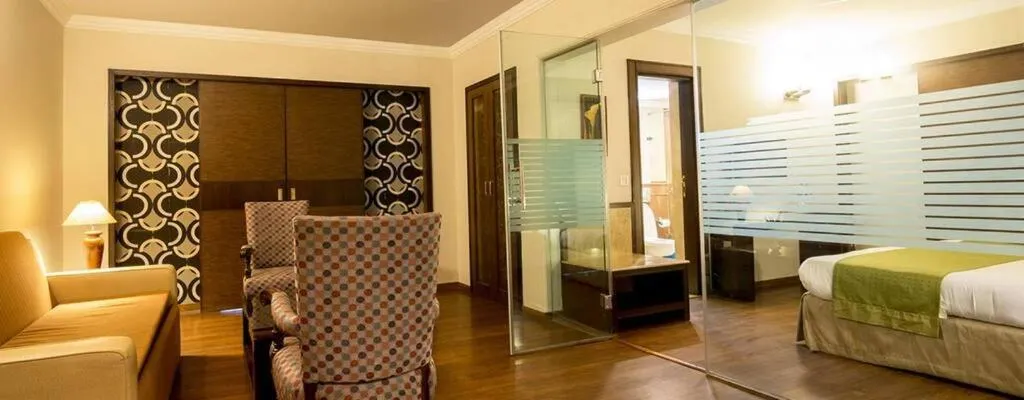 Seating area, Bed in Vikram Vintage Inn