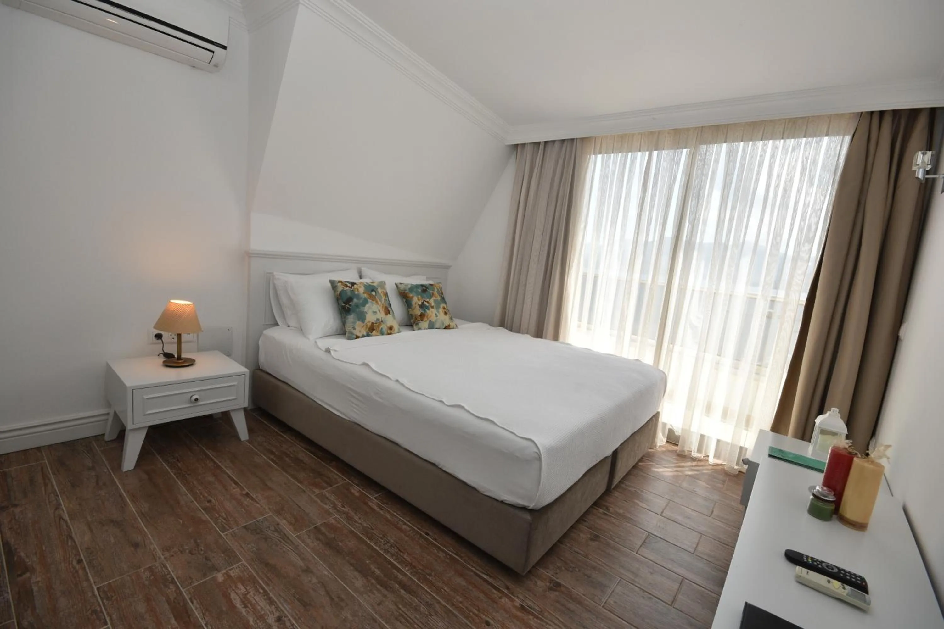 Bed in Aurasia Beach Hotel