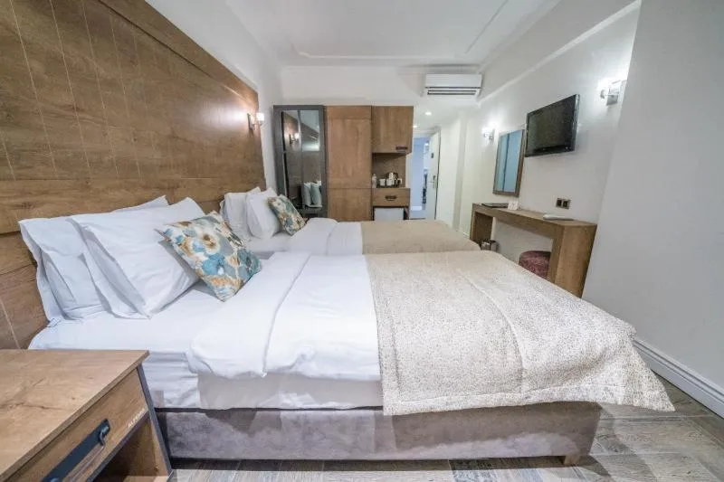 Bed in Aurasia Beach Hotel